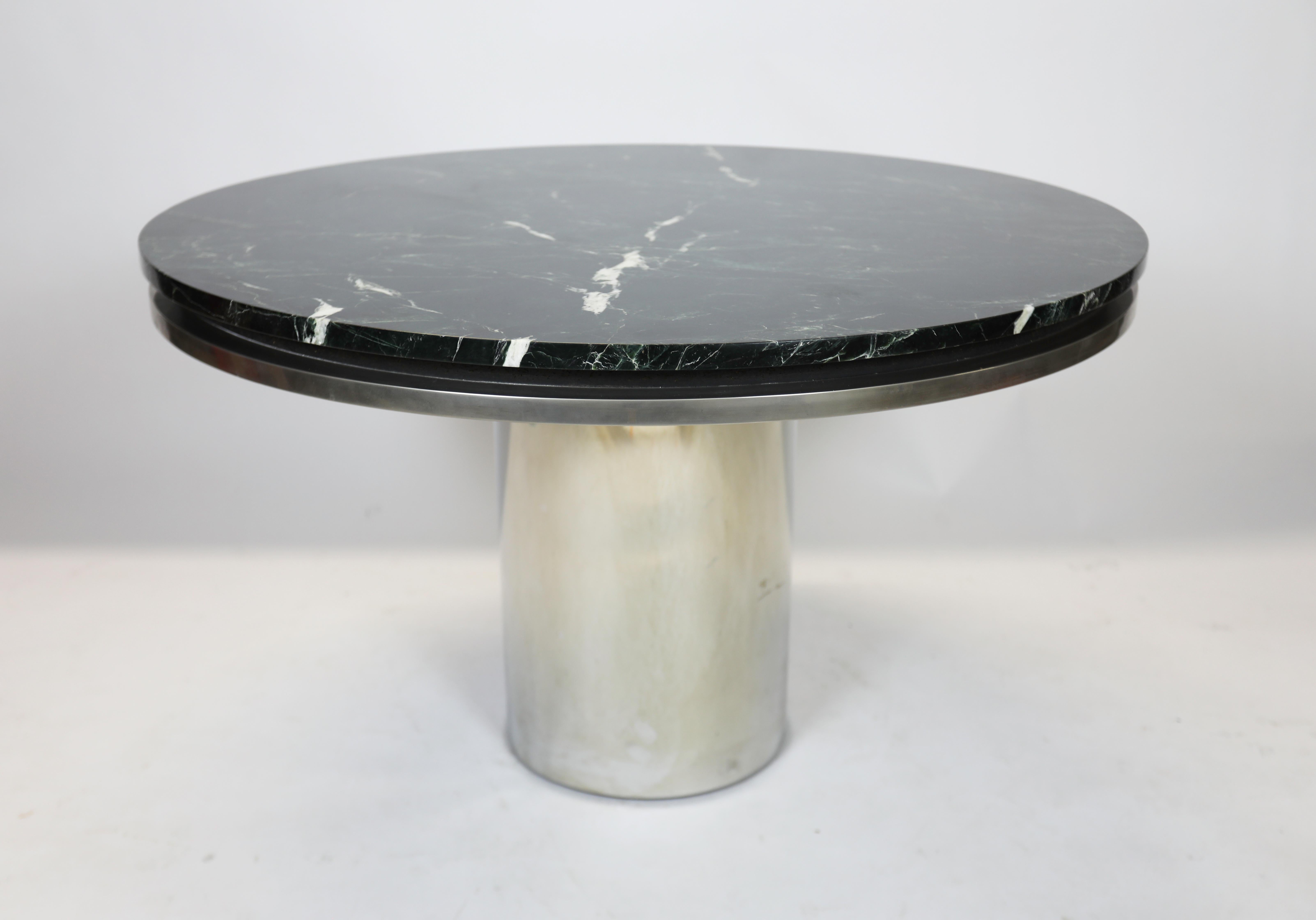 Round side table in polished stainless steel.
Beautiful dark green marble top
Authenticated by Tom Langevin.
 