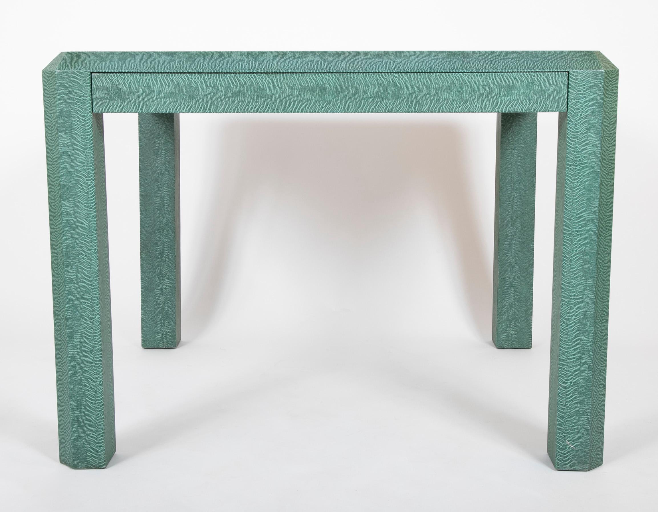 Karl Springer game table, clad in green embossed leather in American lizard pattern. The table has a storage drawer lined with growgrain black fabric. Signed / branded Karl Springer 1993 on the underside. Kneehole height for this table is 25
