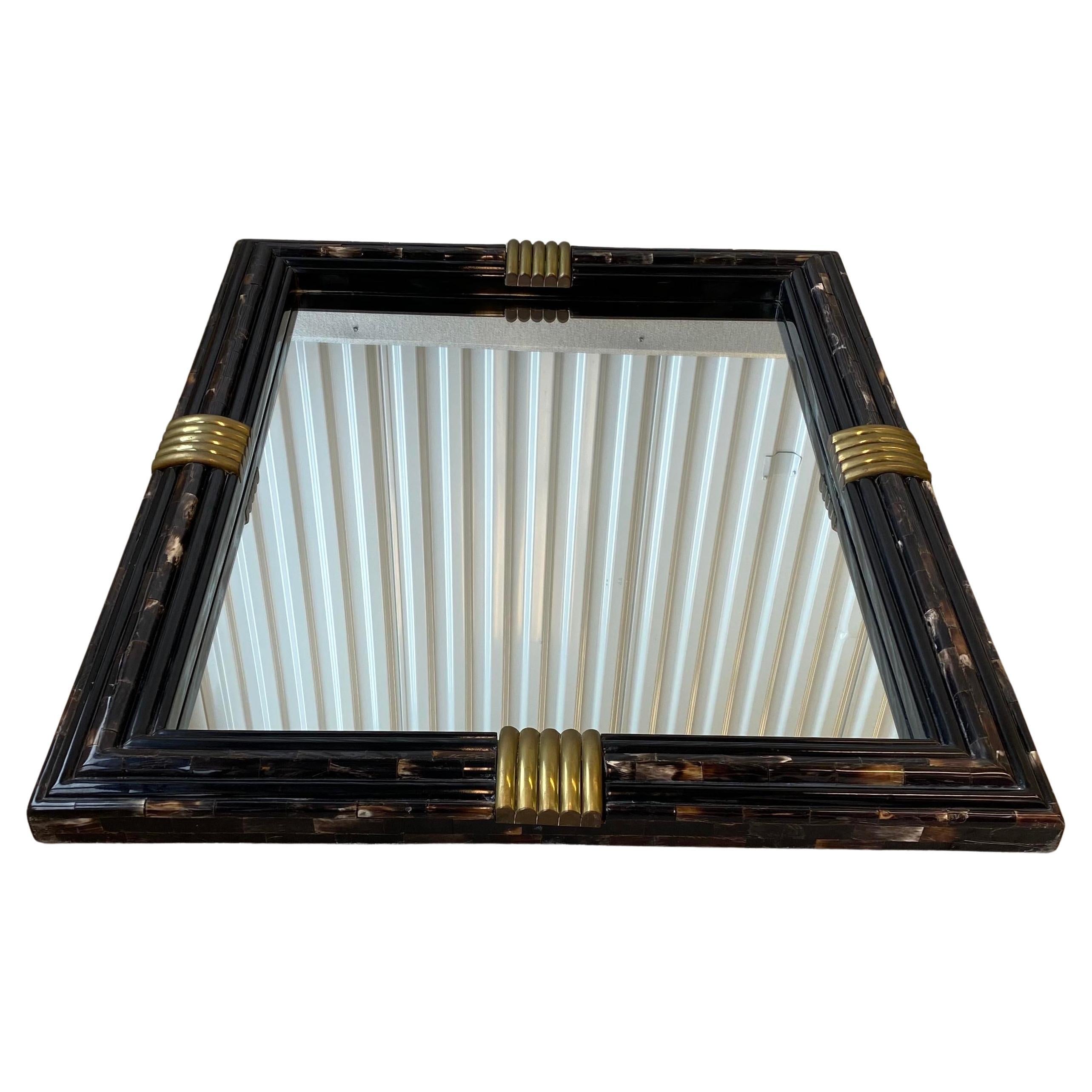 Monumental inlaid horn mirror with bullnose brass detail. In the manner of Karl Springer or Enrique Garcel. Inlaid tessellated horn tiles meticulously laid in a brick pattern around the mirror. Sculptural ribbed brass detail on all four sides of the