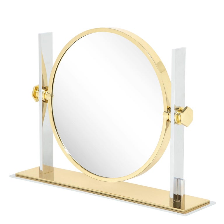 Meticulously crafted extra large vanity/dressing table mirror in polished steel and brass with magnifier on one side and mirror on the other by Karl Springer, American 1980's. This is not the standard size these mirrors were made. This one is much