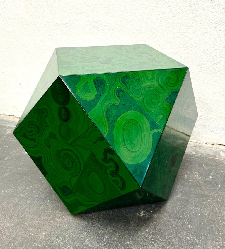 Rare faceted table consisting of triangles and squares, the surface is beautifully hand-lacquered in a faux-malachite pattern. Originally used with a glass top as a coffee table, the size and form lends itself to a versatile range of uses, from