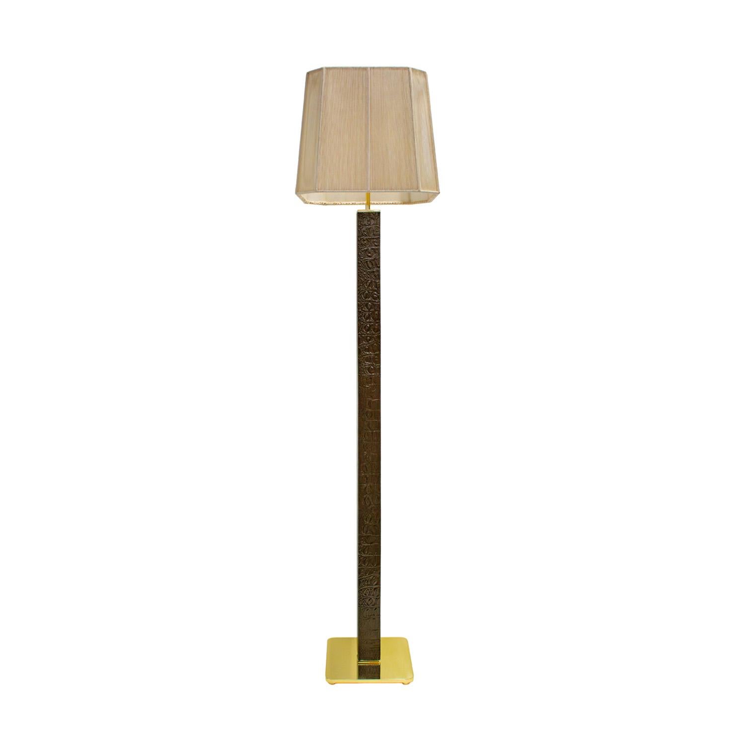Beautifully crafted floor lamp in deep brown and black embossed crocodile leather with  polished brass base, trim and hardware by Karl Springer, American 1970's.  This floor lamp is super luxurious.  Brass has been newly polished and lacquered. 