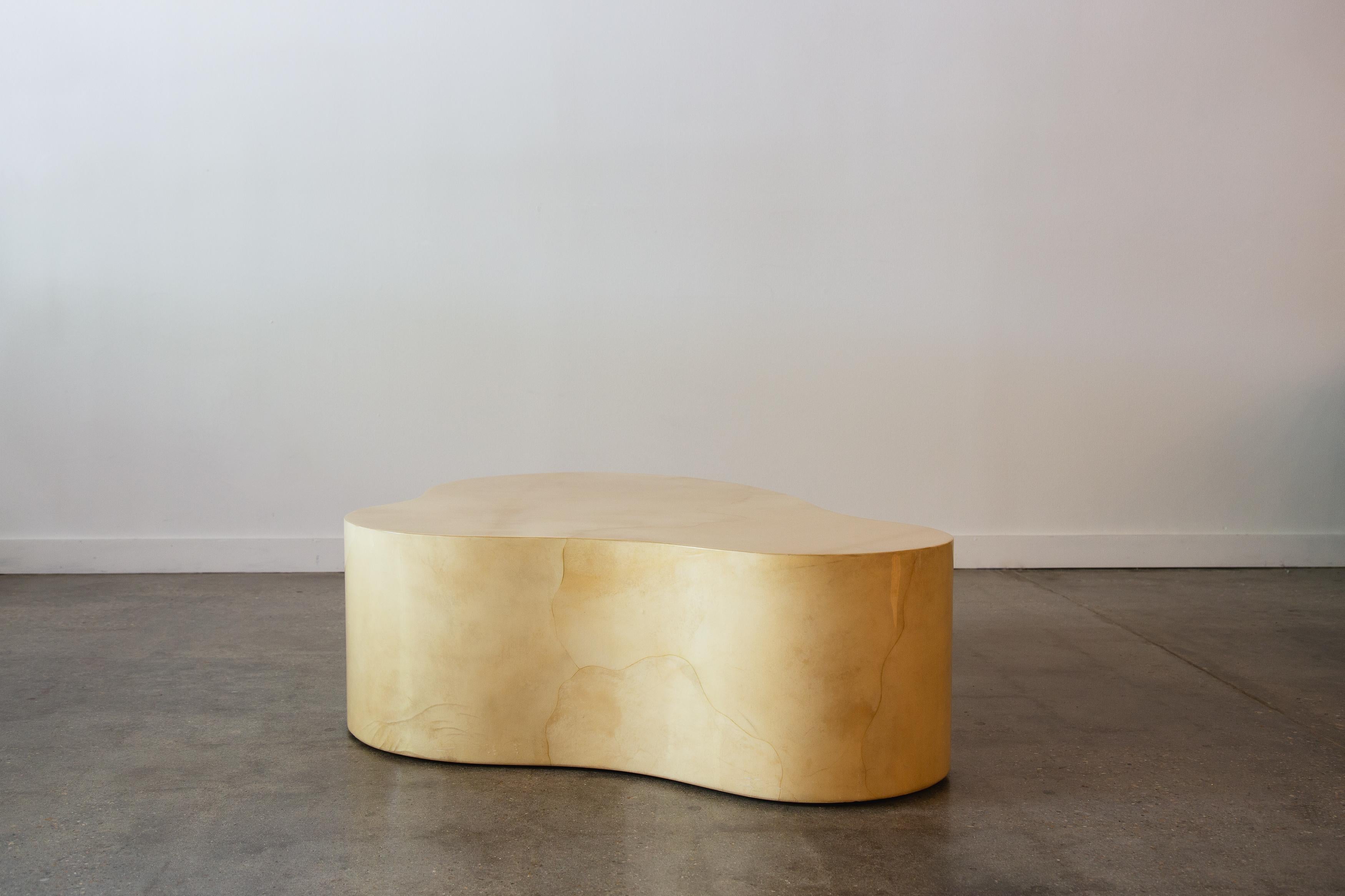 An exceedingly rare free form coffee table designed by Karl Springer.  This table executed in a clear lacquered goat skin in a beautiful natural color way. Purchased from the original owner family. Stamped with the date of manufacture dating this