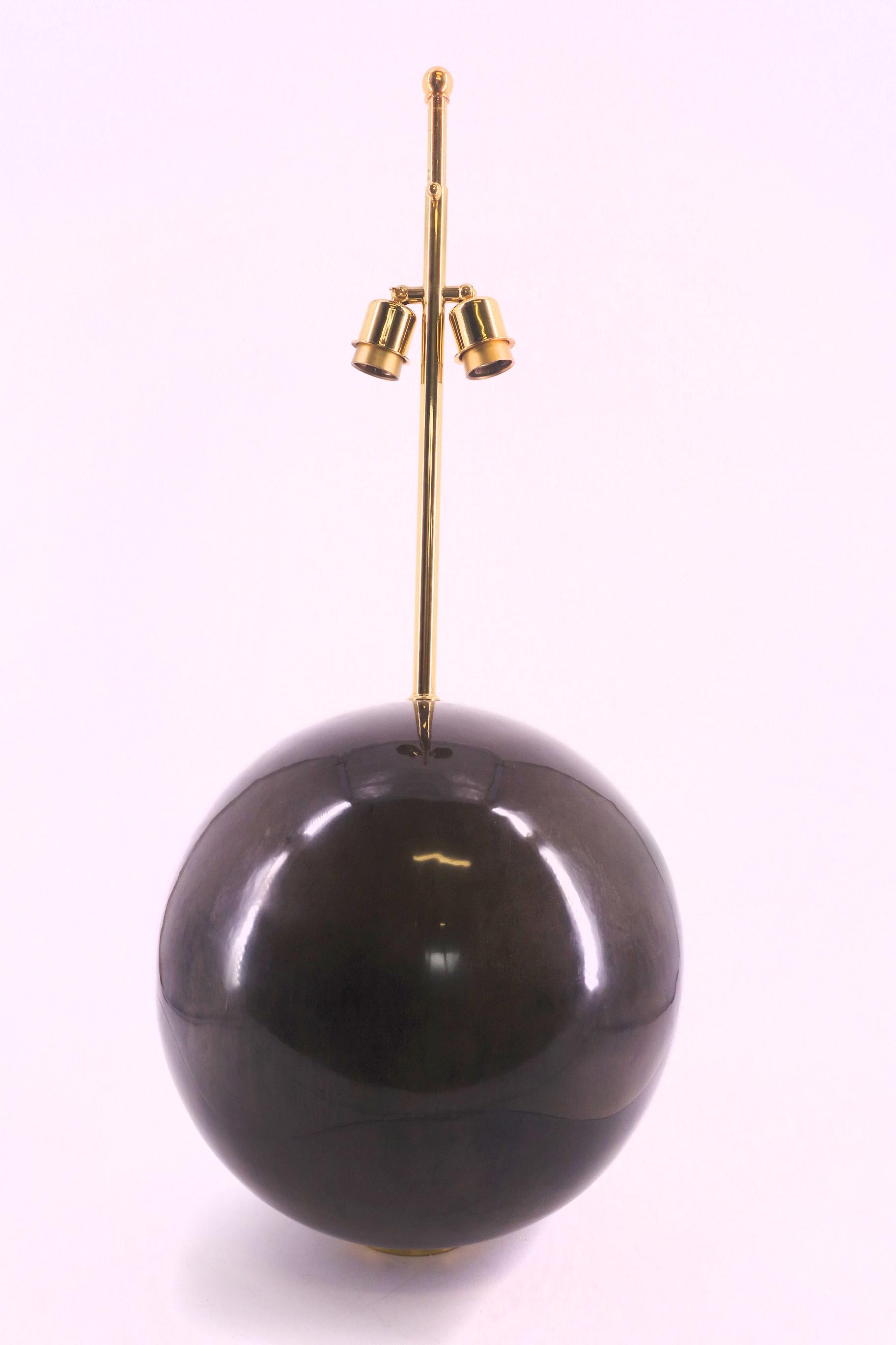 Ball table lamp designed by Karl Springer covered in grey goat skin with brass details.

 