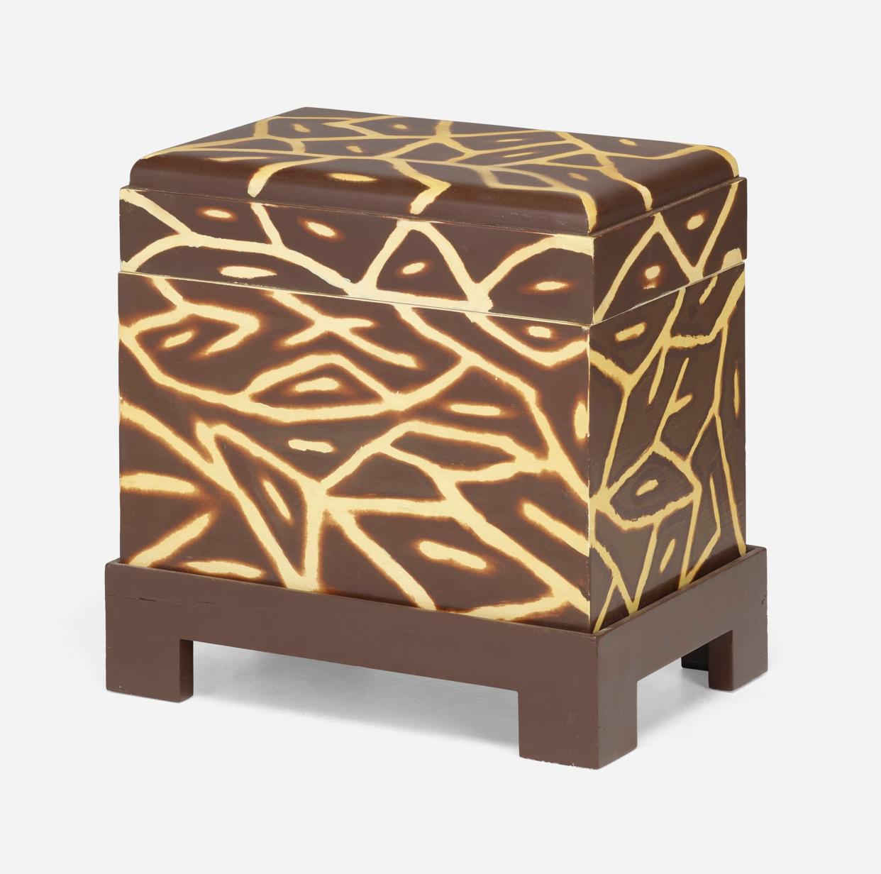 Outstanding hinged and lidded Kyoto box by Karl Springer. Fair amount of storage with suede panel lining on bottom and top. Brown and ivory lacquer is hand applied. Sits in a parsons style cradle or stand. Functional size can also be used as a side