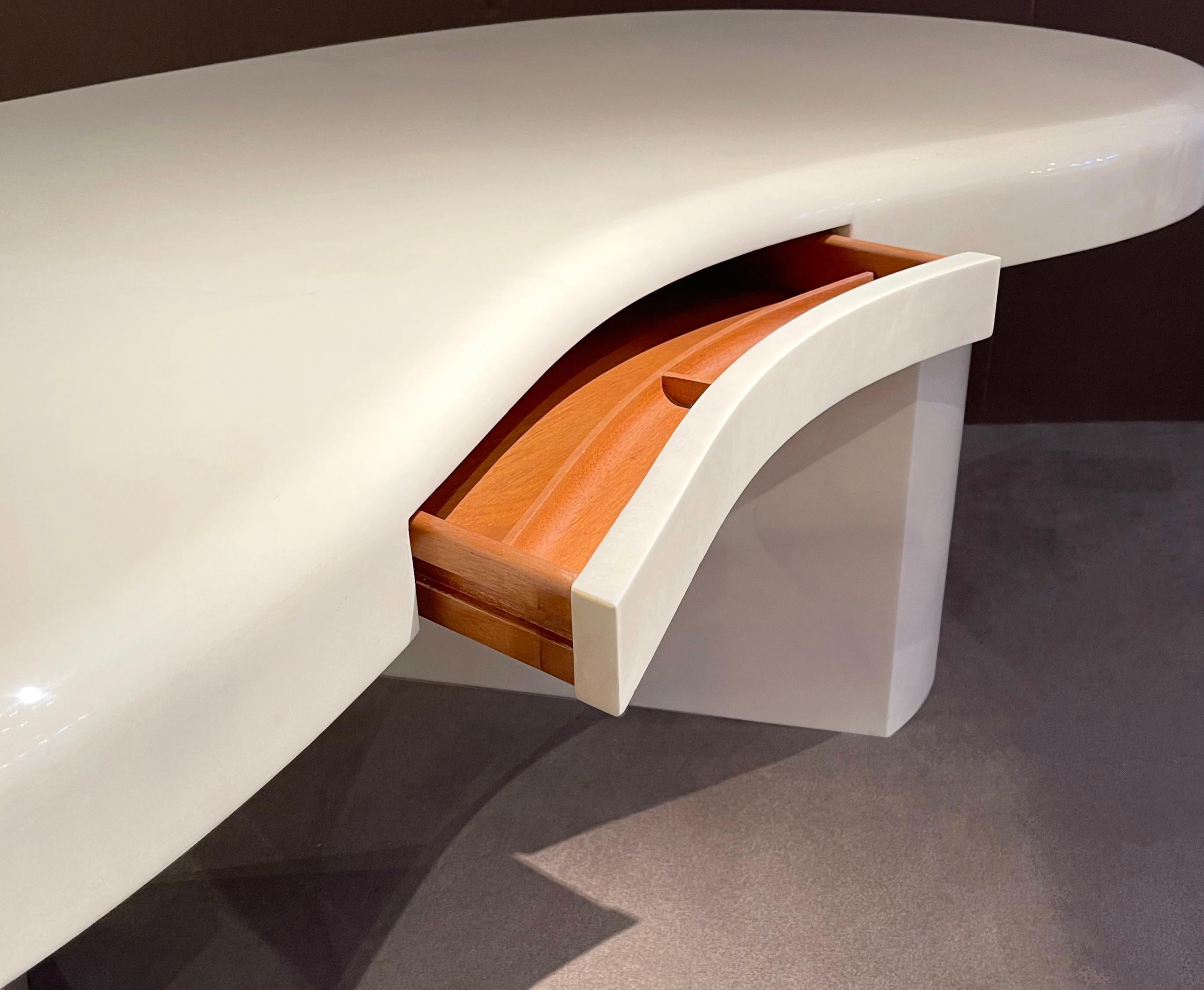 Authentic and very rare Karl Springer Free Form desk with drawer*. The color is ivory and warmer than white as shown. Dated March 9th 1990. As seen in the original Karl Springer catalog. An opulent example of Springer's designs. Leather clad in
