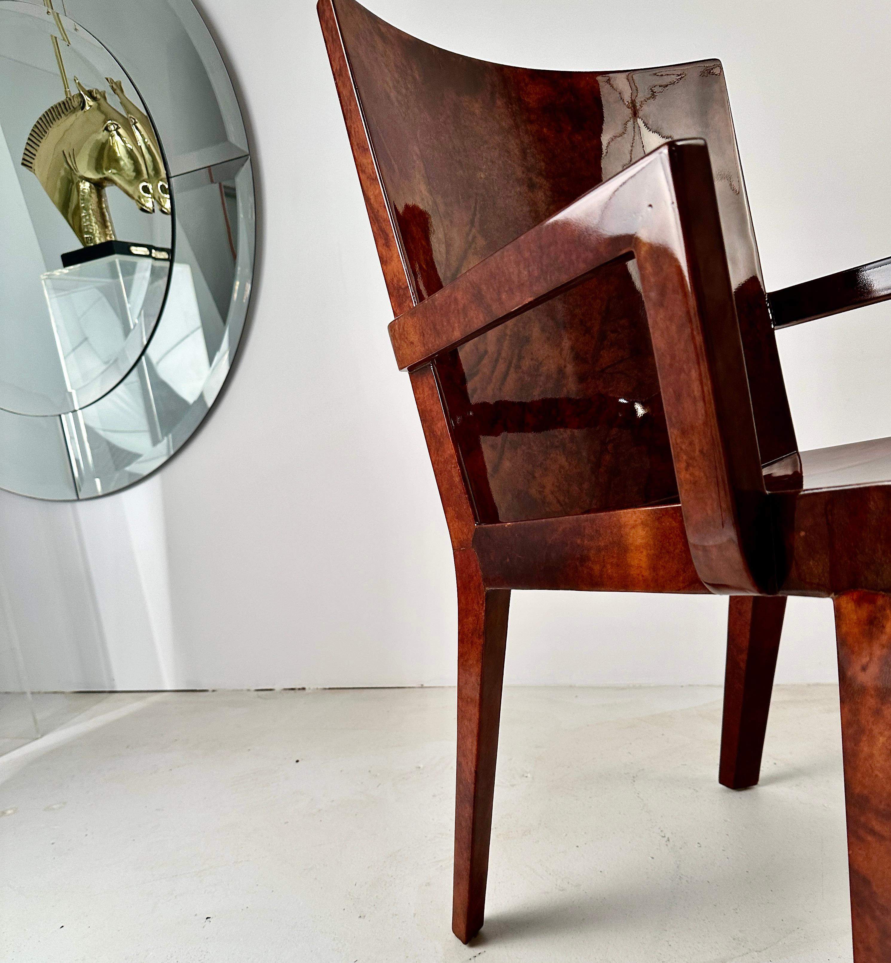 Karl Springer's lacquered goat skin pieces are amongst his most impressive. Springer, well known for outstanding quality and attention detail, produced the JMF chairs starting in 1980 in a number of custom finishes. This example features a figured