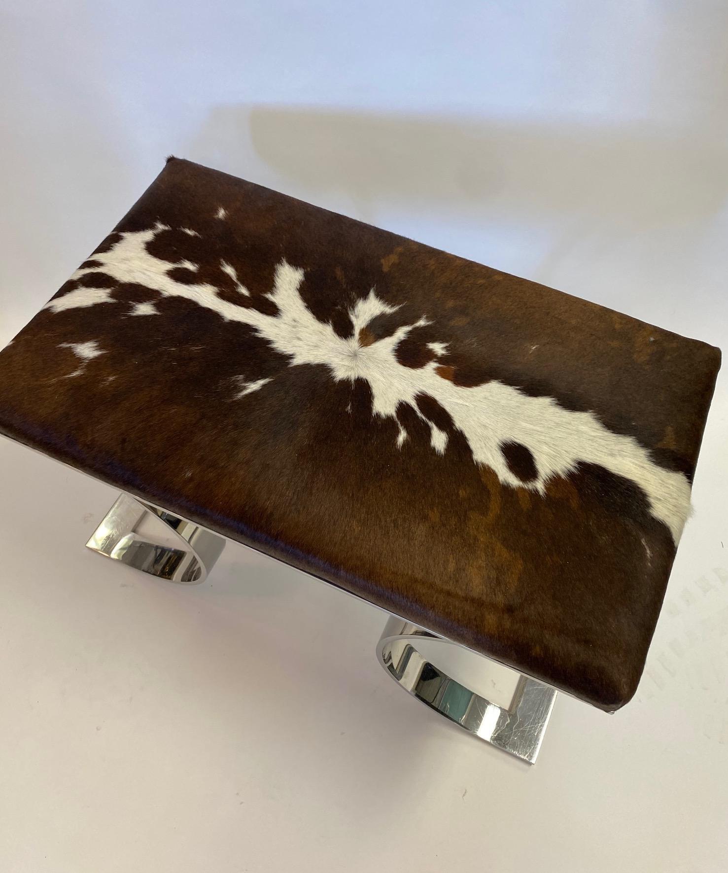 A Karl Springer JMF Bench
Stainless Steel covered in Cowhide
A fine example of an iconic form