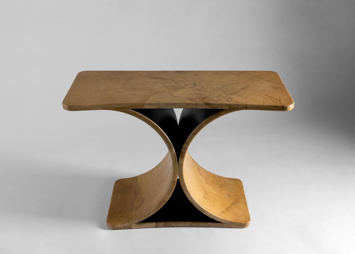 This early example of Springer's JMF console table is clad in goatskin and unique for its subtly bowed front.