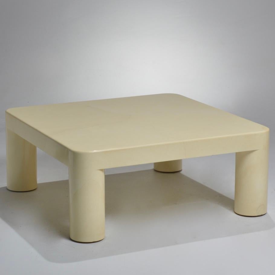 Square ivory-colored goatskin and lacquer coffee table designed by Karl Springer featuring thick rounded table legs and rounded corners.
Karl Springer developed an irreverent and non-doctrinaire idiom of bold proportions, and often highly exotic