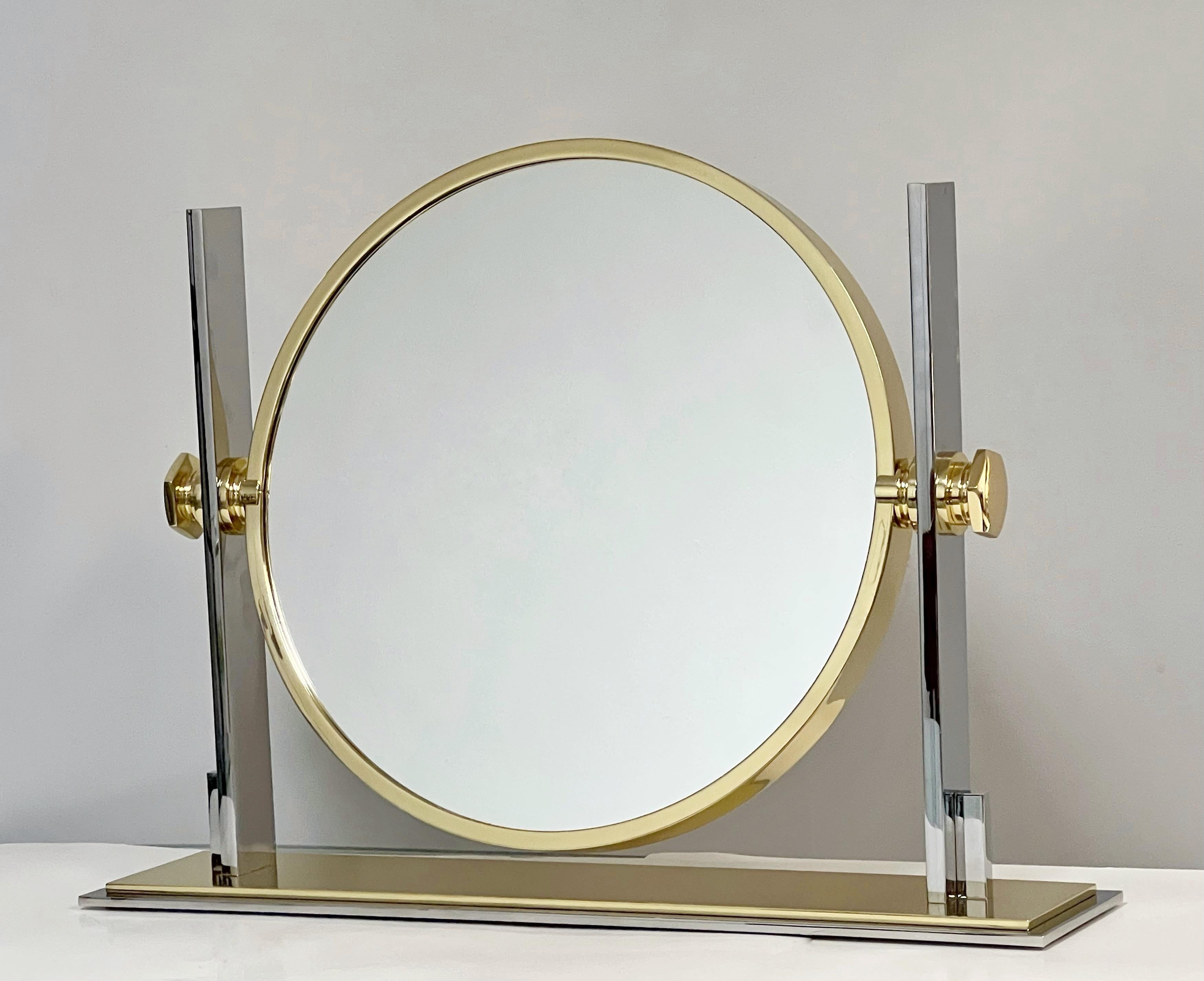 Spectacular mirror by Karl Springer. Substantial yet graceful design, achieved by the use of sumptuous and modern materials, an icon by any standard. The double mirror can be tilted. This is the largest and rarest size for this mirror.