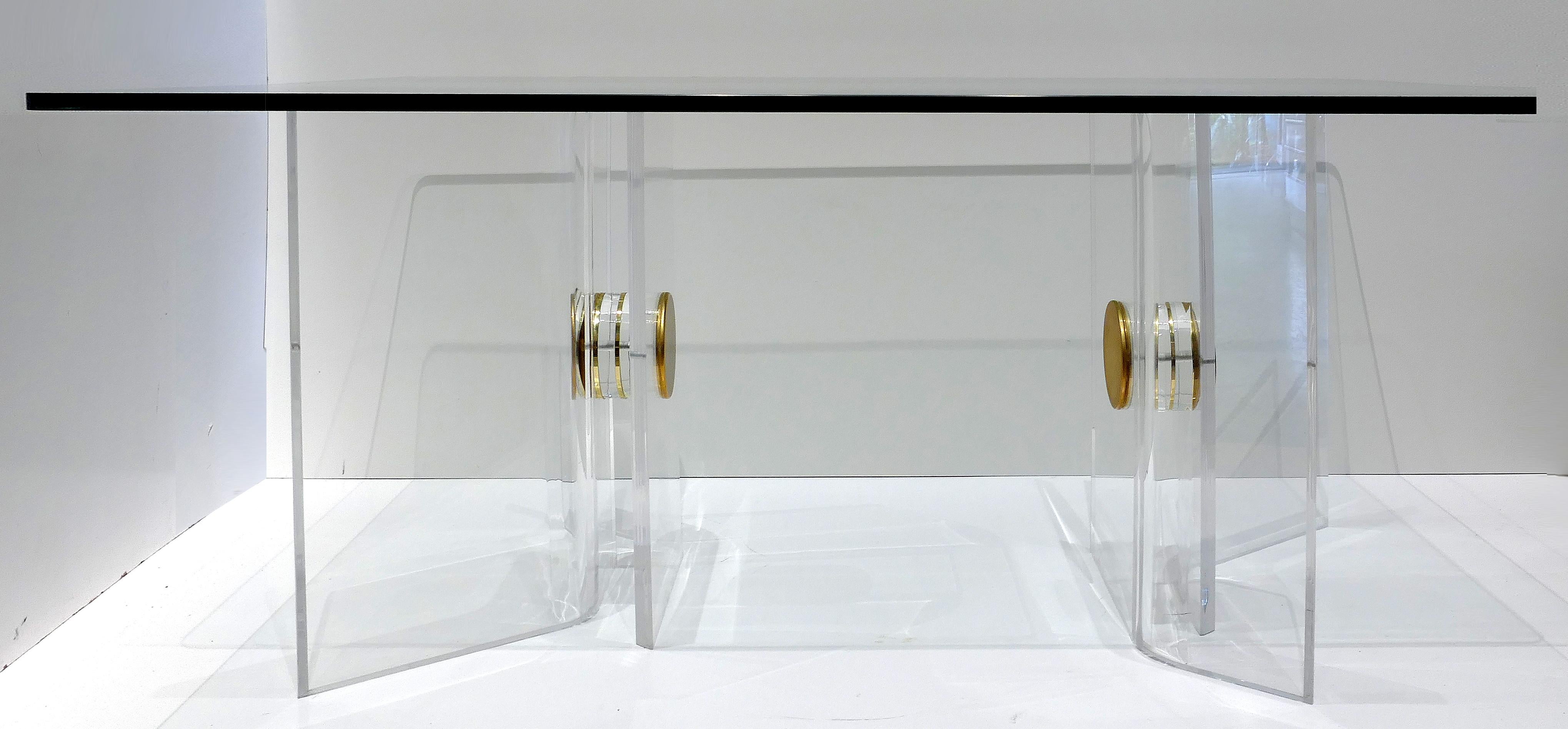 Karl Springer Lucite and brass desk with a glass top

Offered for sale is a stunning Karl Springer attributed Lucite and brass desk with glass top. The substantial Lucite bases are asymmetrically formed and assembled with Impressive overscale