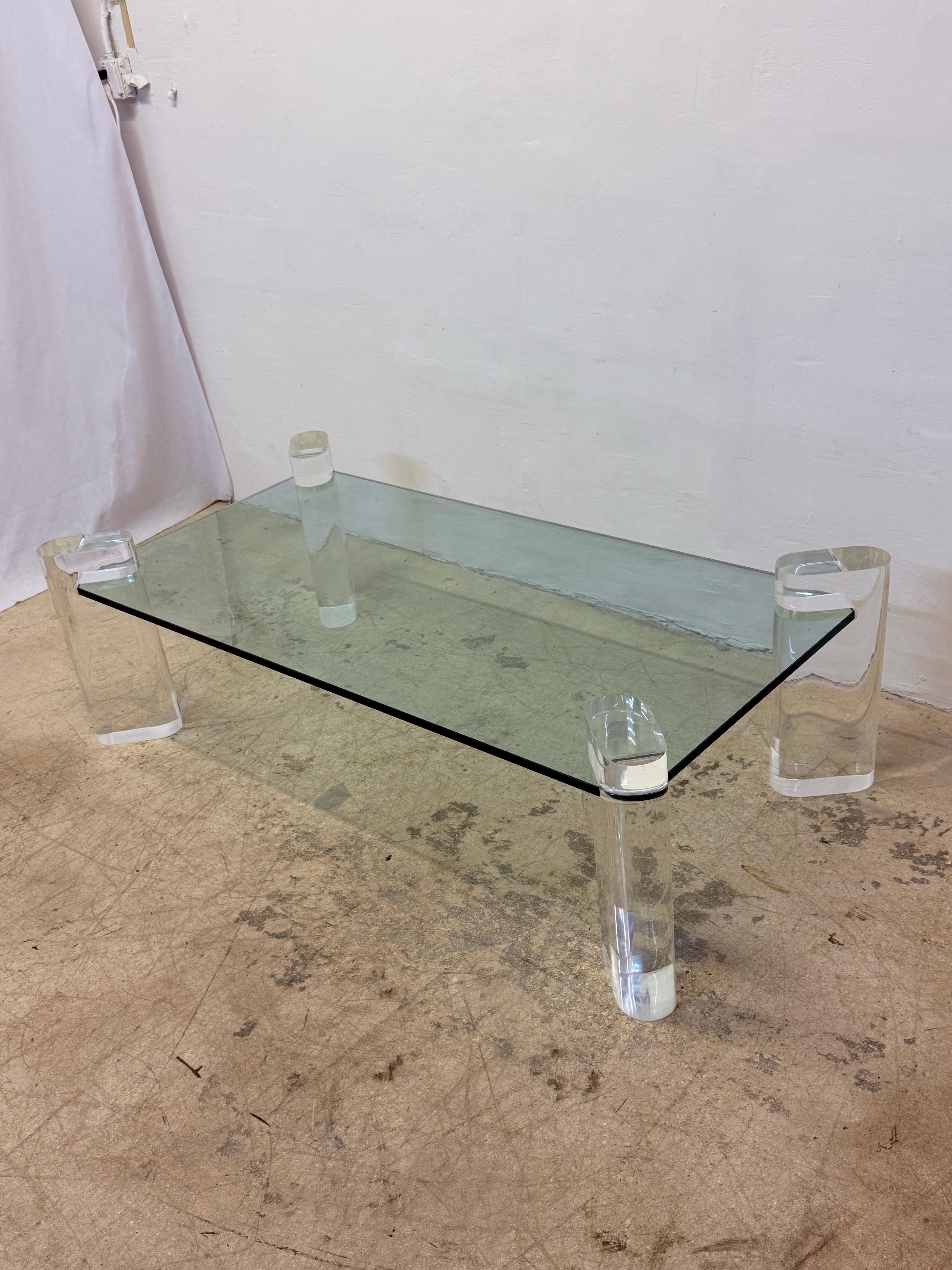 Karl Springer lucite and glass top coffee table circa 1970s, signed on one leg.  

The table legs can be sold without the glass top if a custom size is required.  Inquire for shipping quote.

Current glass measurements: W59.75