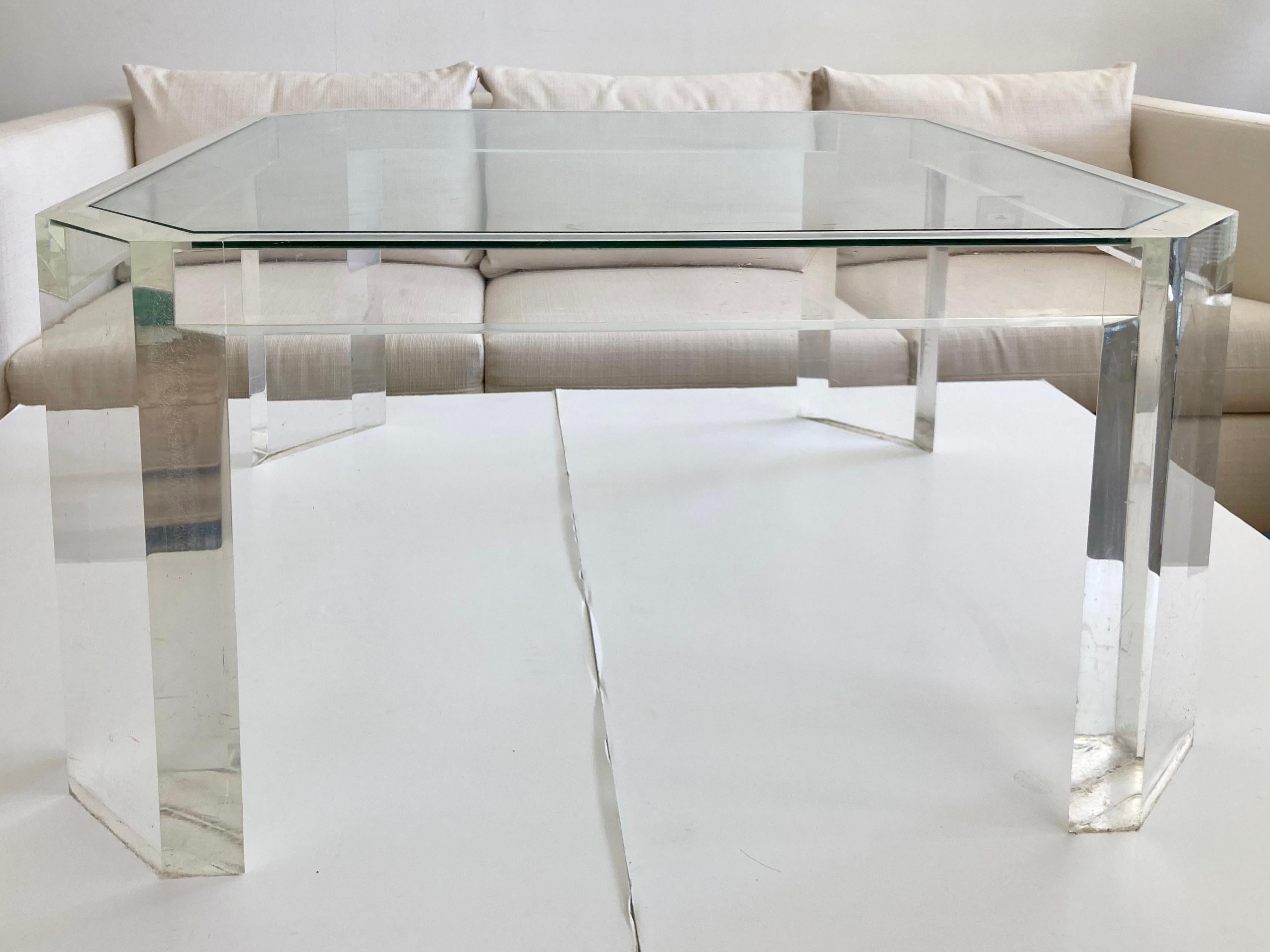 Karl Springer lucite coffee table with angled corners and inset glass top. Nice detail work and quality construction from the 1980s. This is a smaller size coffee table, so perfect for the jewel box rooms. Add some modern style to your design