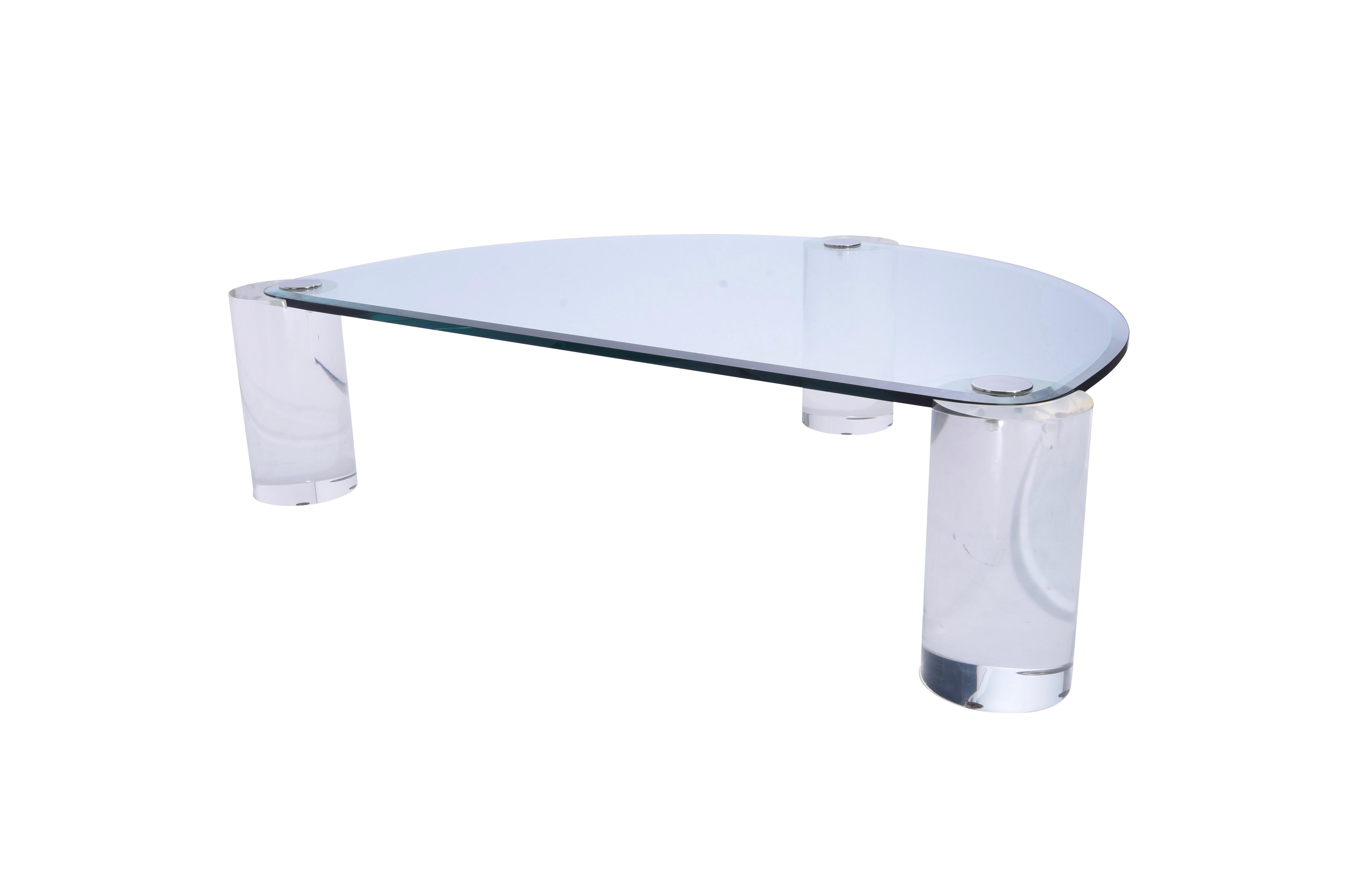Lucite sculpture leg coffee table by Karl Springer with glass top.