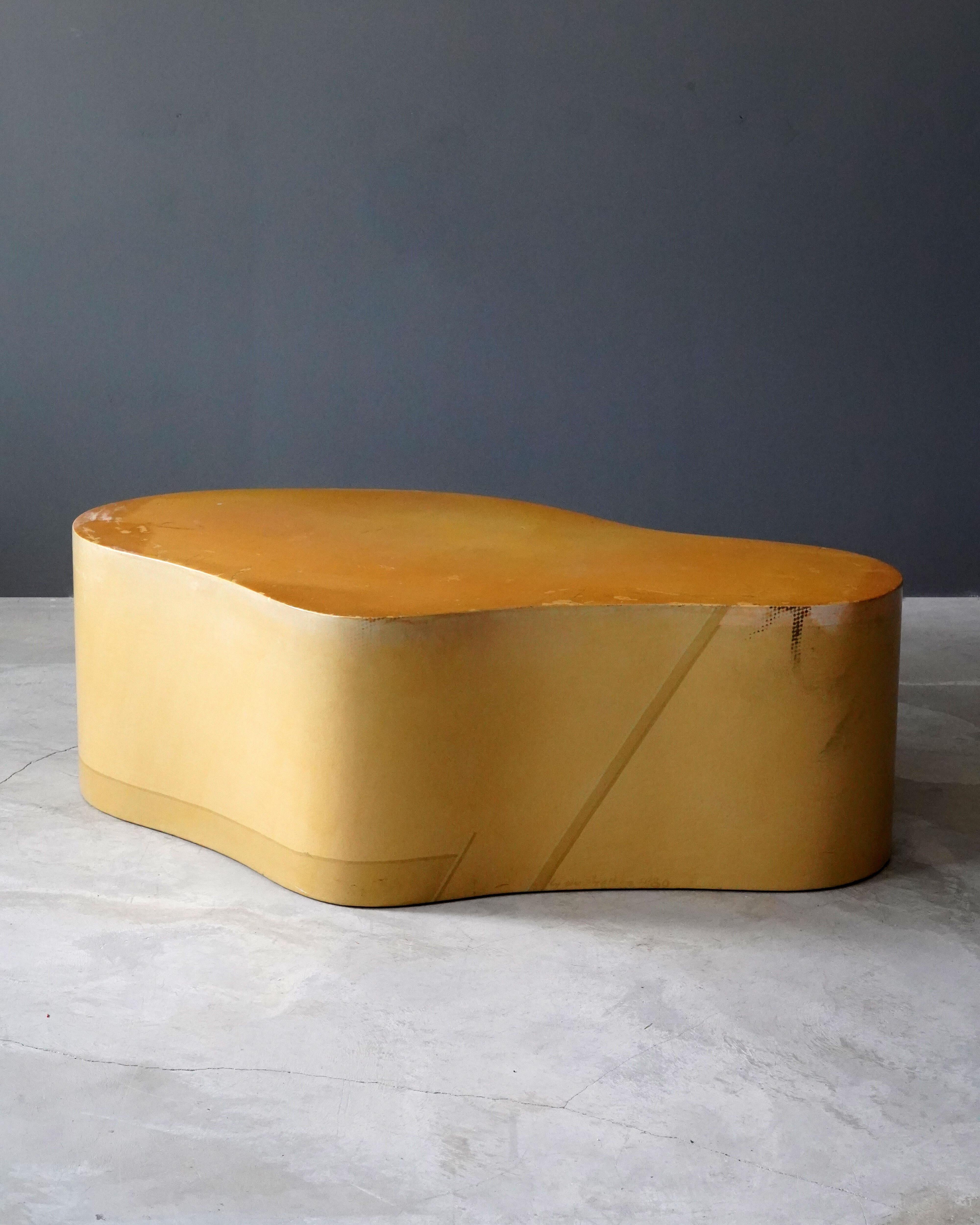 An organic / biomorphic coffee / cocktail table, designed and produced by Karl Springer, painted by Lynn Shelton in beige / yellow tones, c. 1980. Signed Lynn Shelton 11/80' along lower edge. Executed in painted paper over laminated plywood.


 