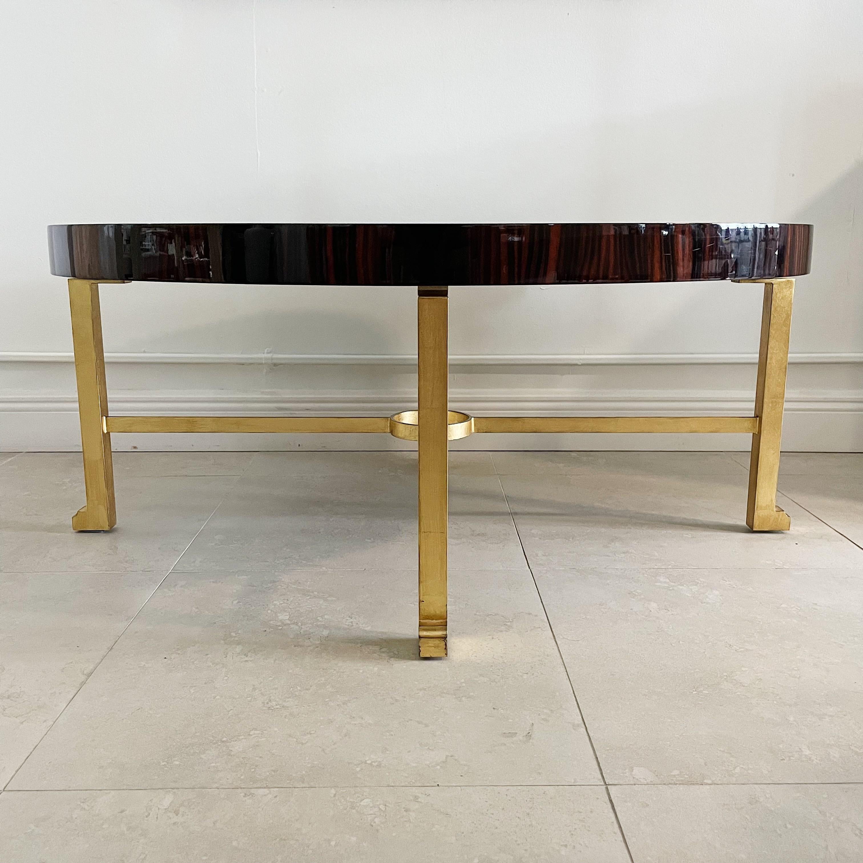 Macassar ebony veneer, gilt iron and parchment coffee table by Karl Springer circa 1995. Signed on underside.