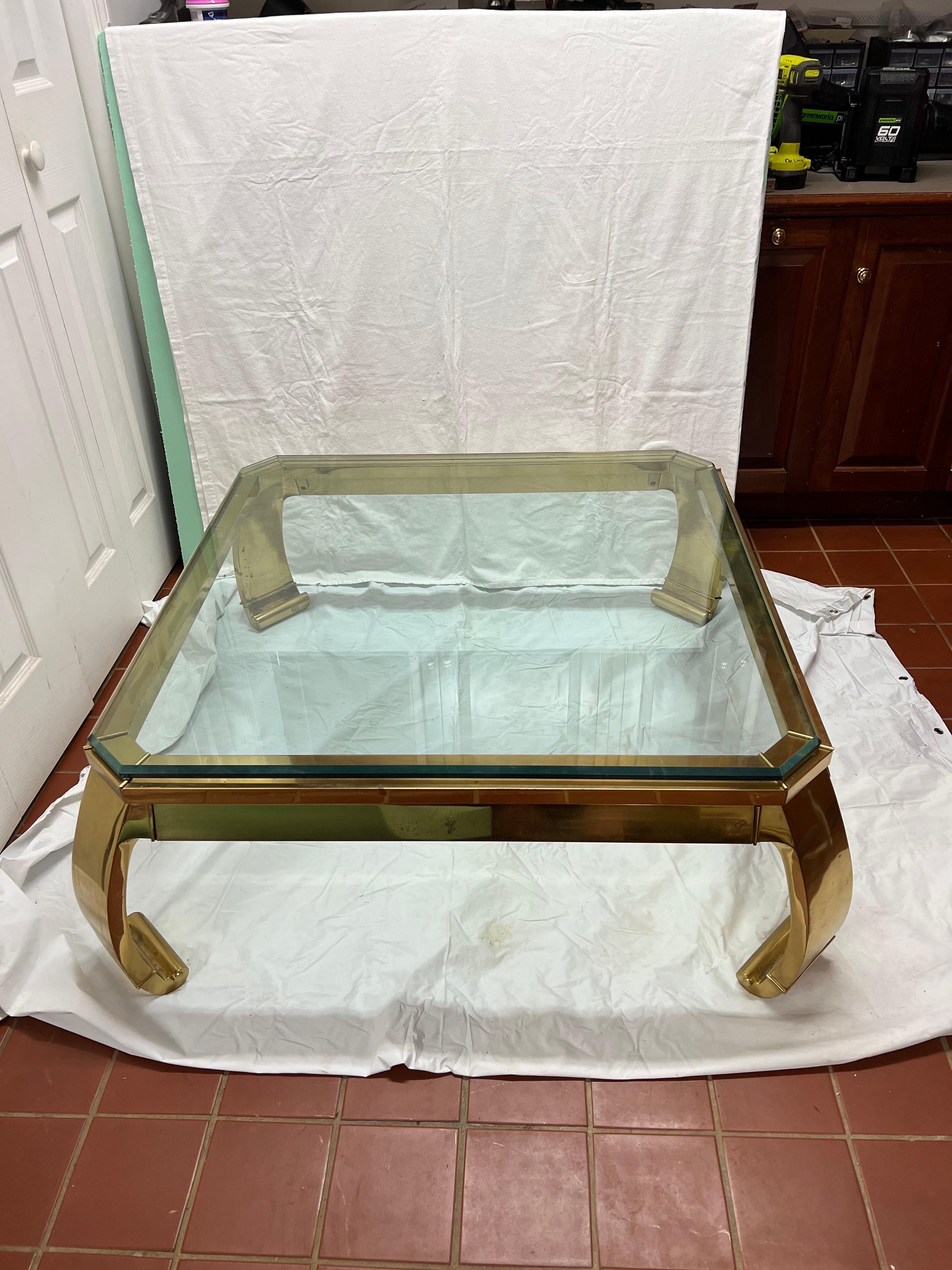 Mastercraft Solid Brass Ming Waterfall Coffee Table . Classic Asian inspired coffee table attributed to designer Karl Springer This beauty is made of solid forged brass. It is the epitome of 1970s sexy chic. The 3/4 inch beveled glass top sits on