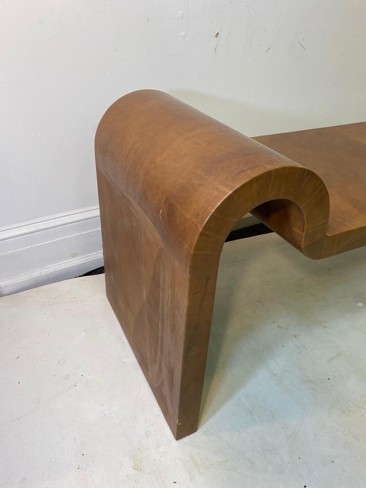 Modern leather surfaced bench with waterfall rounded armrests, made by Karl Springer in 1987. Signed and dated by the designer. The piece is in great vintage condition with age-appropriate wear.