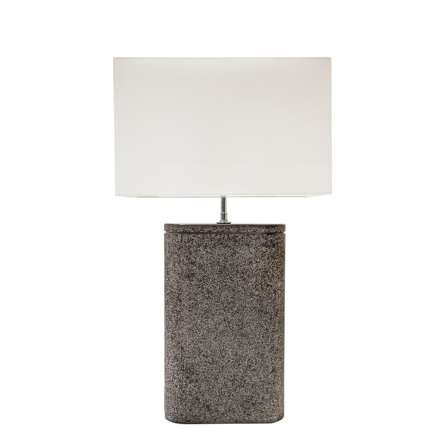 “Oval Table Lamp” in solid black granite with lavastone finish and chrome hardware by Karl Springer, American 1980's. This is a solid block of granite and it has been impeccably finished.  Chrome cleaned and polished.  Newly rewired with new sockets