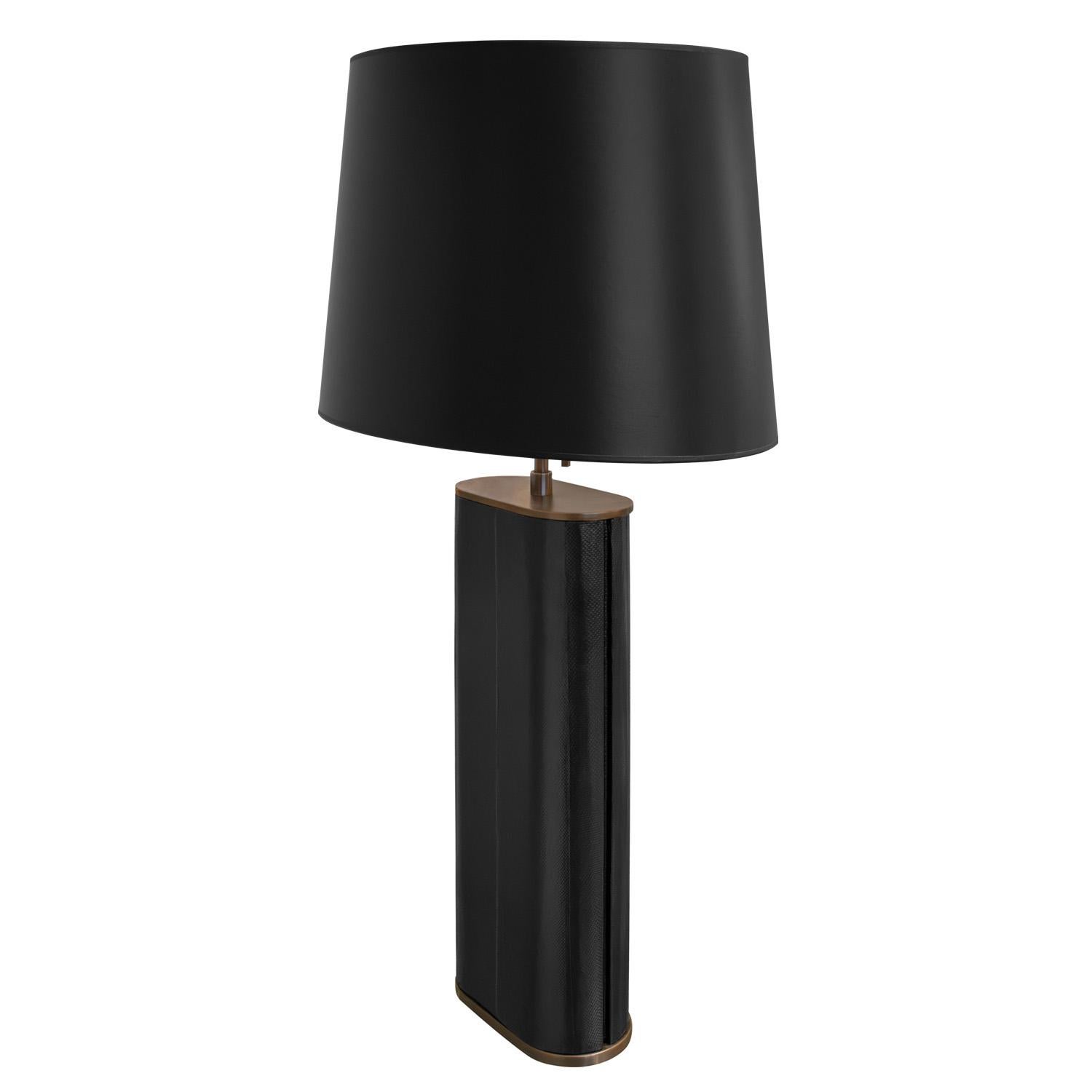 Chic “Oval Table Lamp” covered in black snake skin with bronze base, trim and hardware by Karl Springer, American 1980's. The fine materials and craftsmanship of this lamp are superb. 

Reference:
Karl Springer Red Binder Catalog, published in the