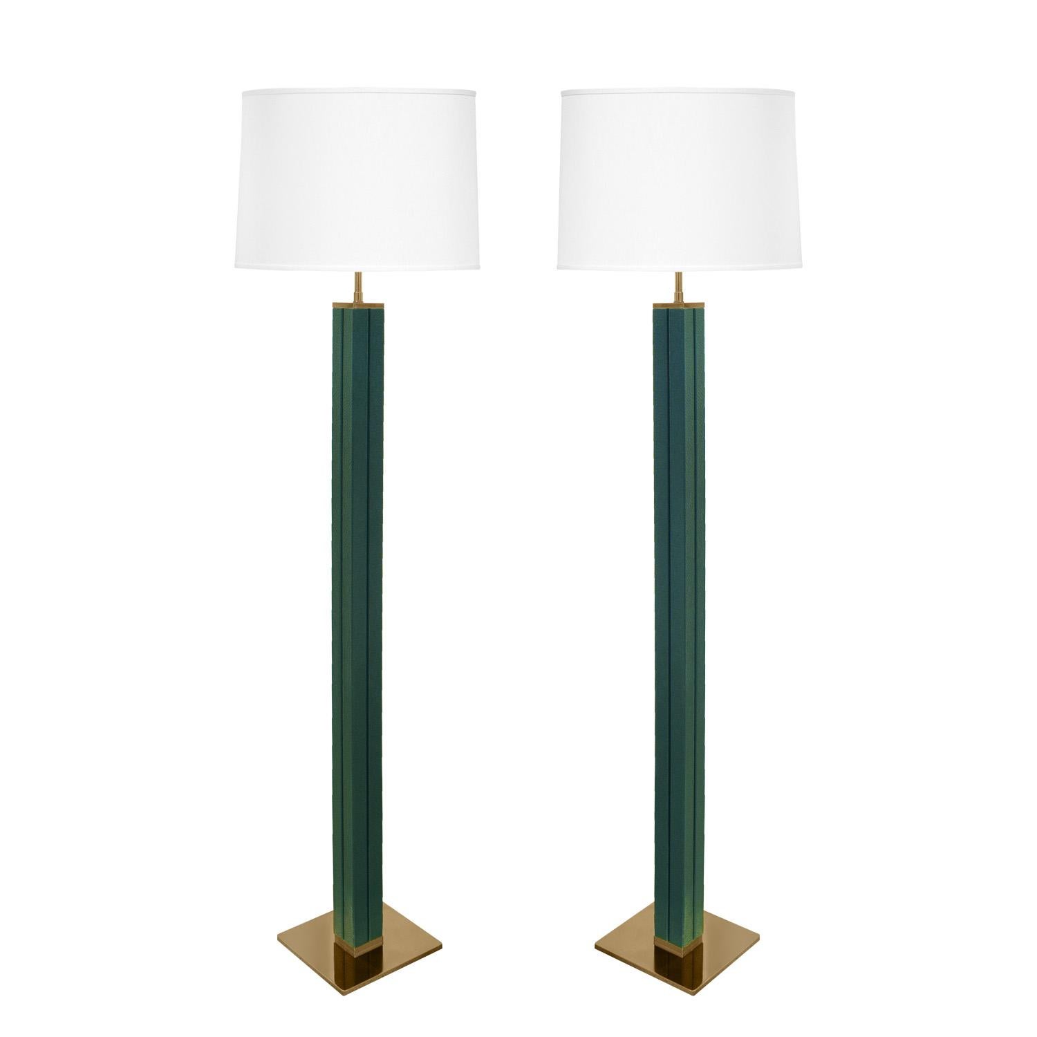 Exceptional pair of floor lamps with square channeled columns covered in forest green embossed emu leather with polished brass bases and hardware by Karl Springer, American 1970's.

Reference:
Karl Springer LTD small paper catalog published in