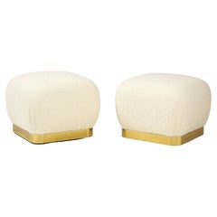 Karl Springer Pair of Souffle Ottomans in Ivory Bouclé and Brass, 1980s