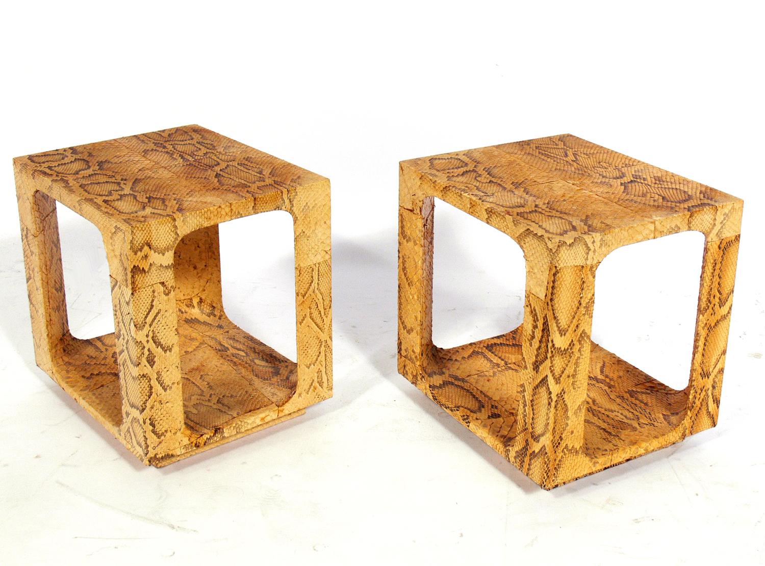 Karl Springer Style Python end tables or plateaus, circa 1970s. Constructed of wood wrapped in genuine python. They retain their warm original patina.