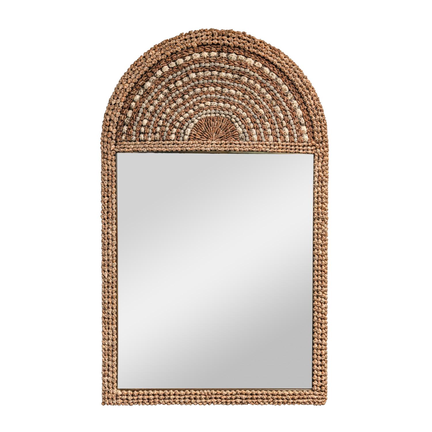 Rare large and exceptional wall-hanging arc top mirror covered with sea shells arranged in a beautiful concentric pattern by Karl Springer, American 1970's.  This piece is meticulously crafted and an early Springer design.   The scale of this mirror