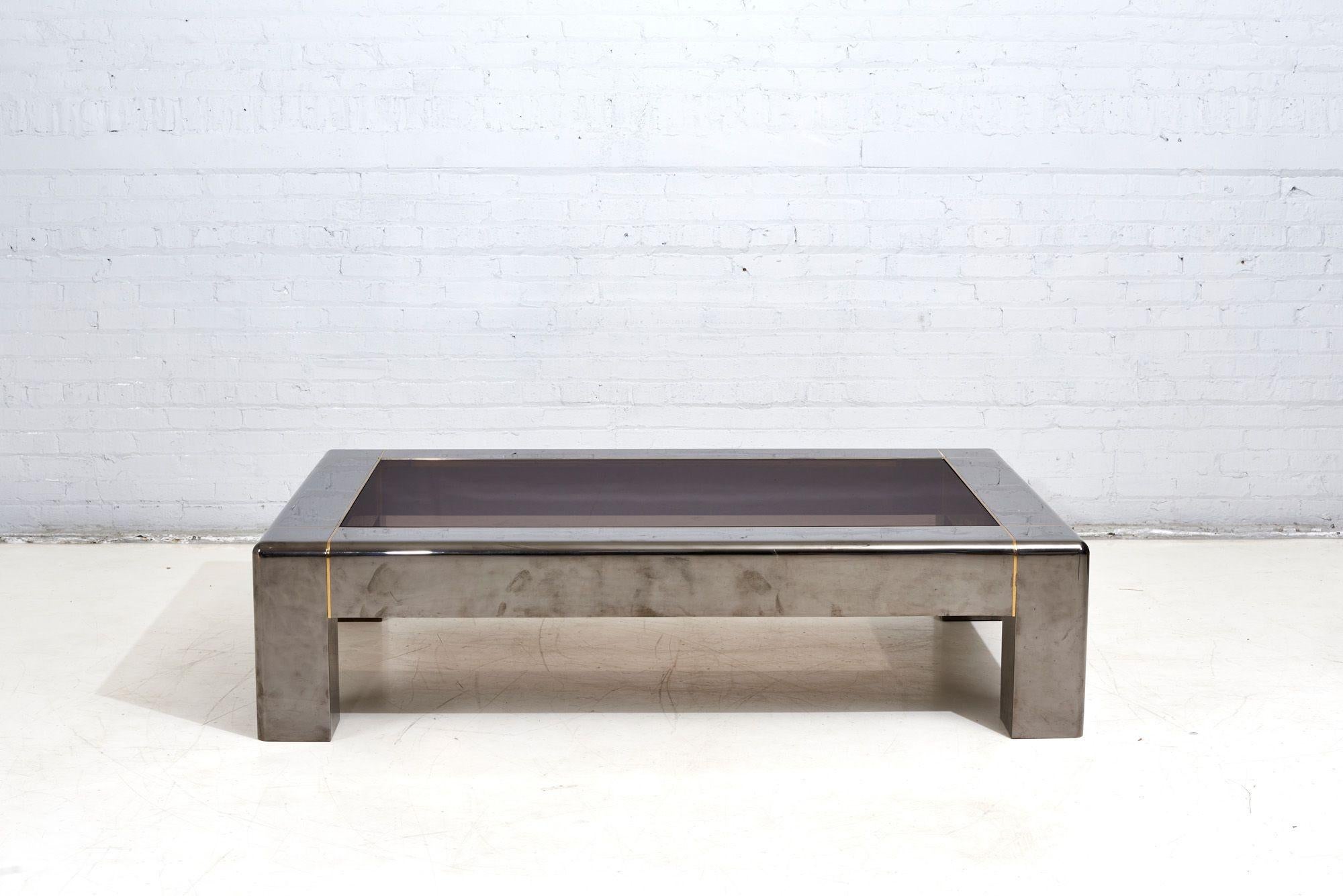 Karl Springer rare Gunmetal and glass Coffee table with bronze inlaid trim 1980. Table is documented in the Karl Springer Ltd. Catalog