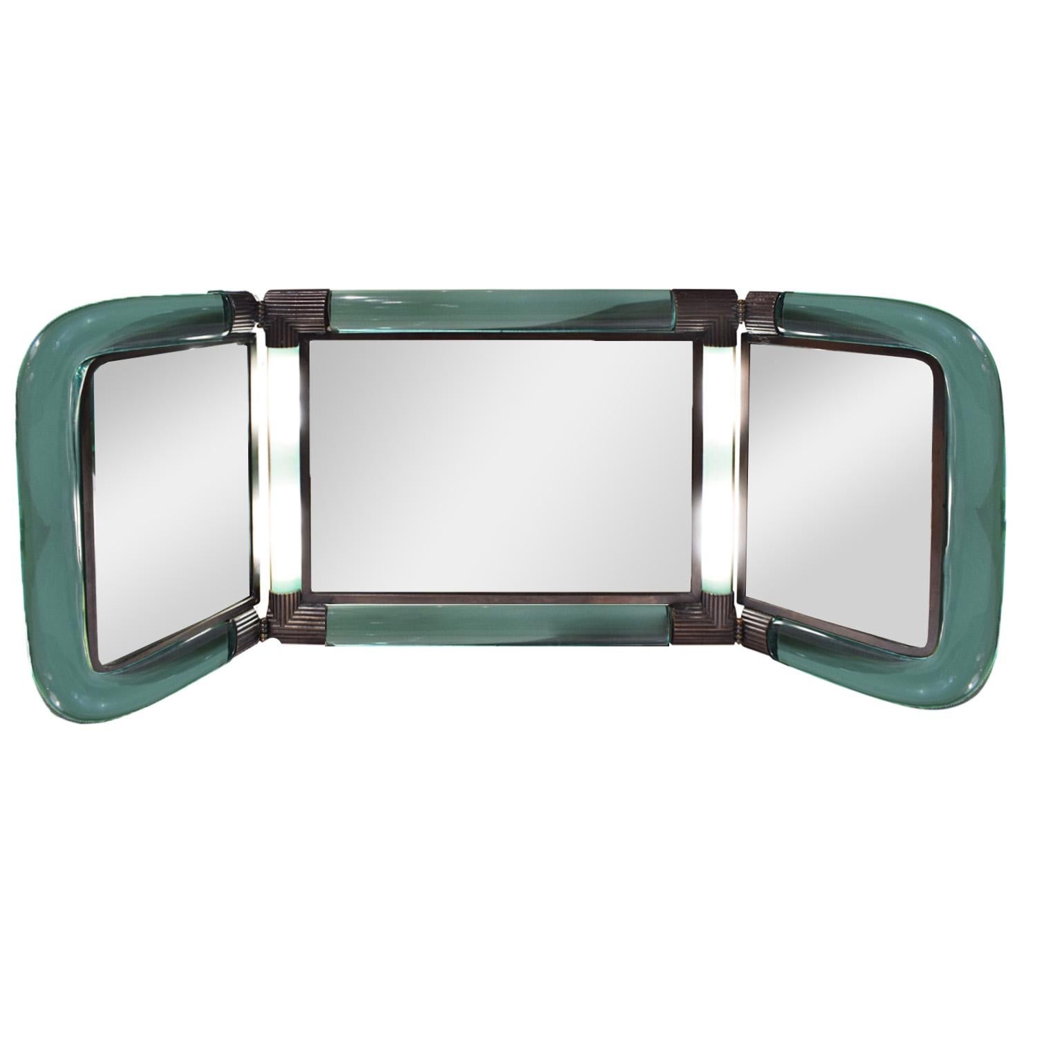 Exceptionnel et rare miroir de courtoisie éclairant en trois parties en verre vert soufflé à la bouche avec des garnitures en bronze artisanal par Seguso (Murano, Italie) pour Karl Springer, Américain, 1980 (gravé 