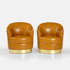Karl Springer Rare Pair of Cognac Leather and Brass Swivel Lounge Chairs, 1980s