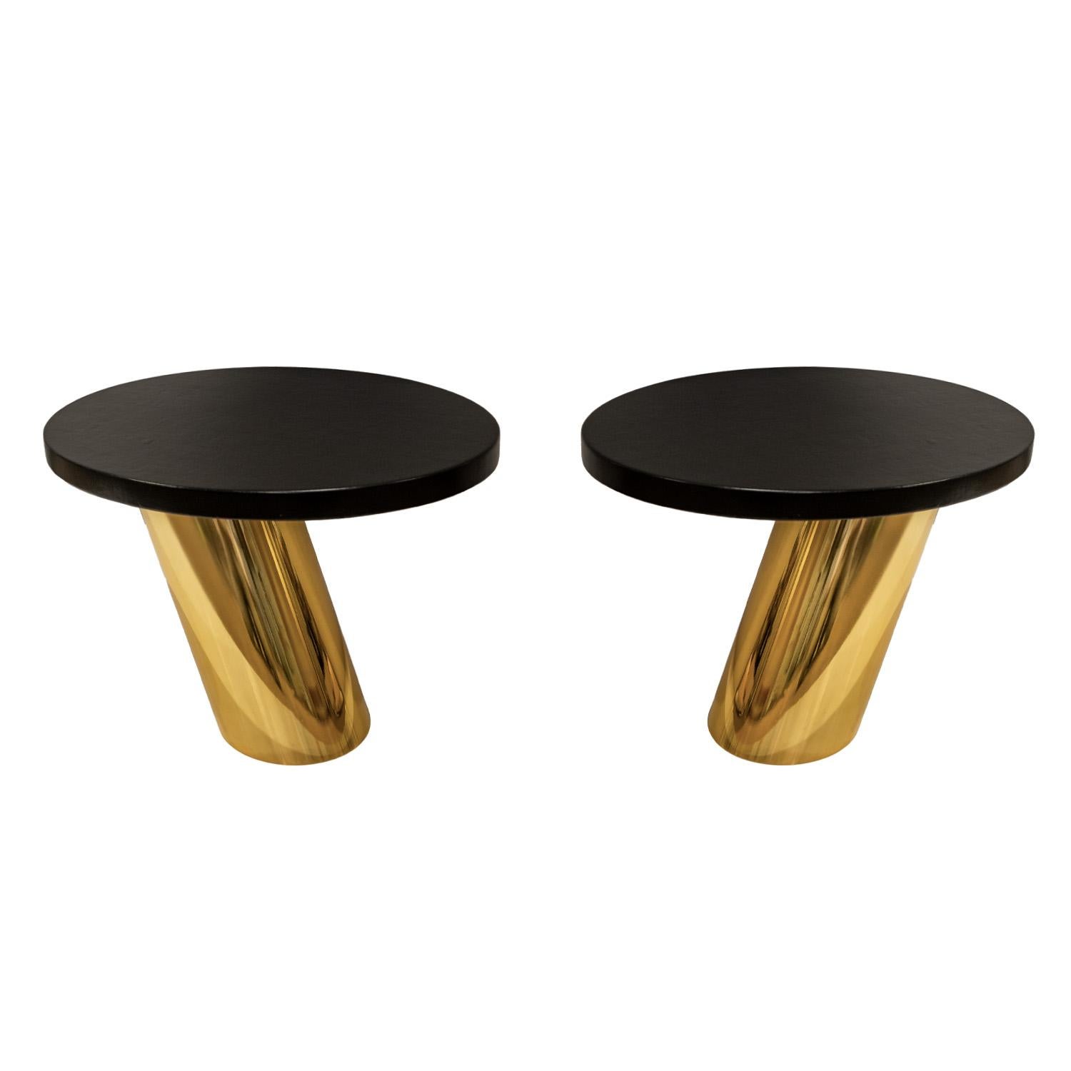 Rare pair of “Mushroom Tables”, cantilevered with black oval leather tops on solid tubular brass bases which fit snugly over heavy lead weights by Karl Springer, American 1990 (both signed and dated “Karl Springer 1990” on underside). The superb