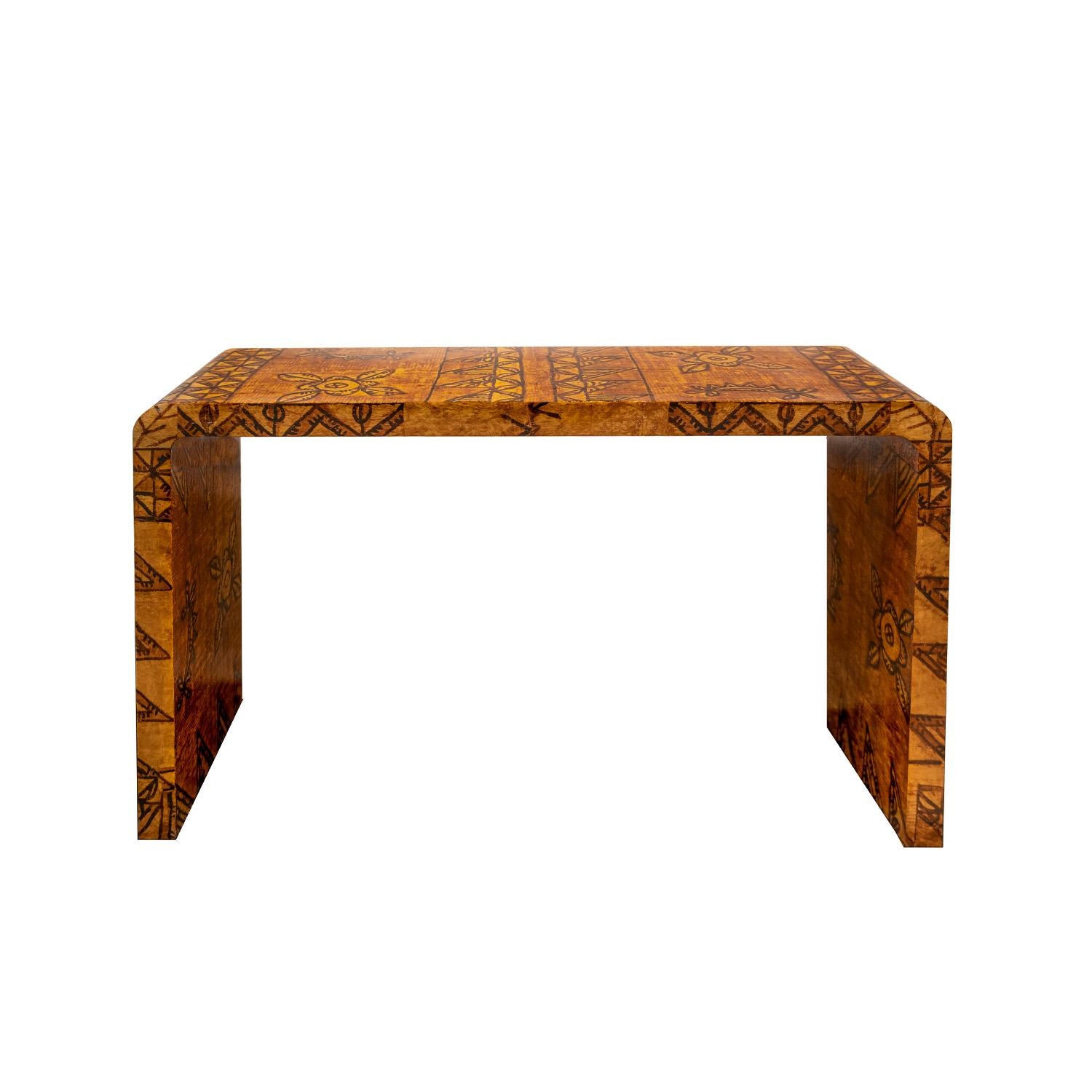 Stunning and rare waterfall console table in lacquered African batik by Karl Springer, American 1970's. Karl Springer used artisan exotic materials in his designs. In the late 1960’s and early 1970’s, he incorporated hand-made African batiks into