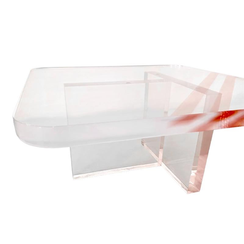 Fabulous Karl Springer rose-tinted Lucite modern coffee table of the 1970s period. Great addition to your modern inspired interiors. The lucite is thick and heavy and the rare rose tint is spectacular.  the top and bottom pieces are not joined and
