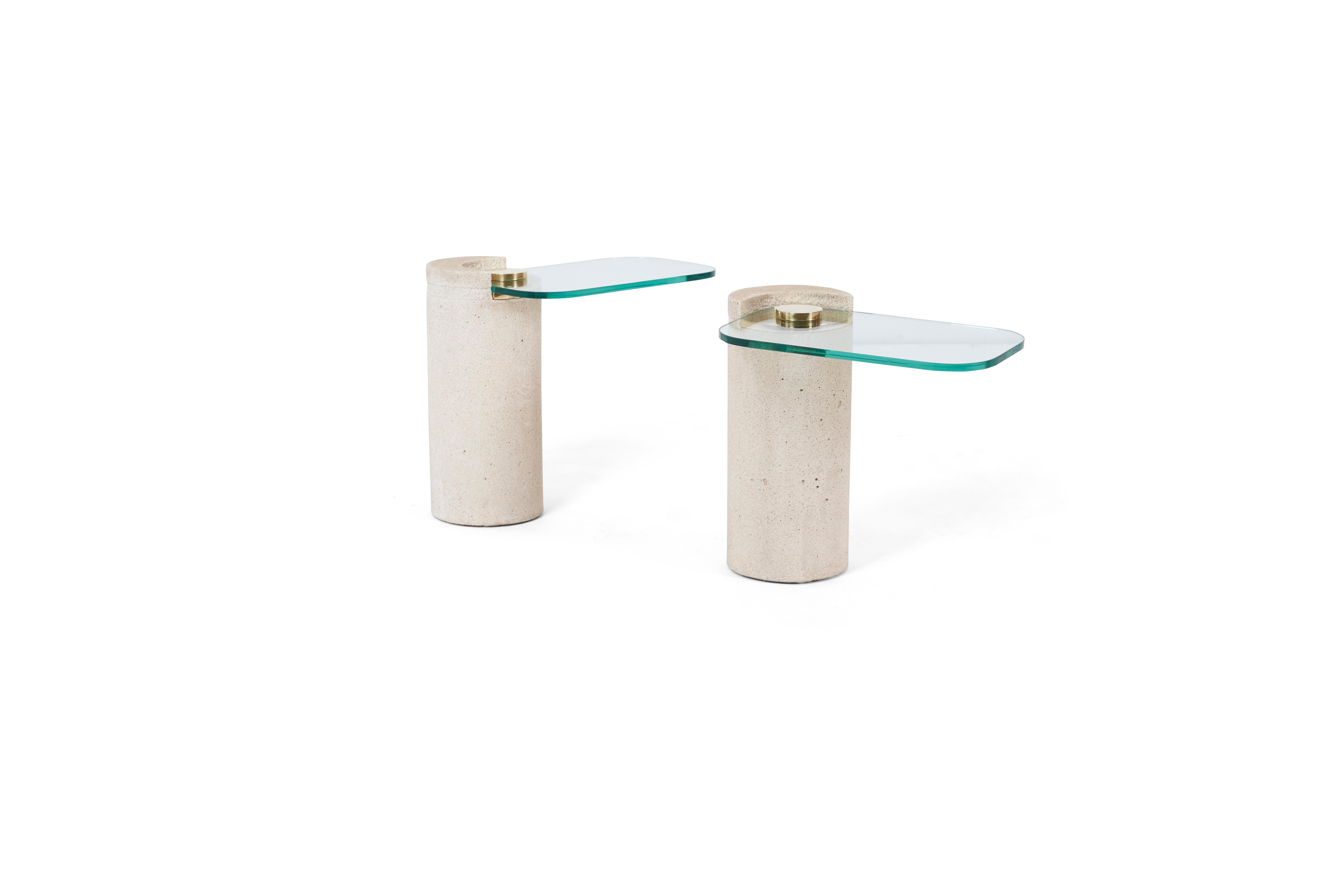 Pair of sandstone drink tables with polished brass hardware and cantilevered glass. Karl Springer, 1980's. New glass

4 tables available. Sold in sets of 2.