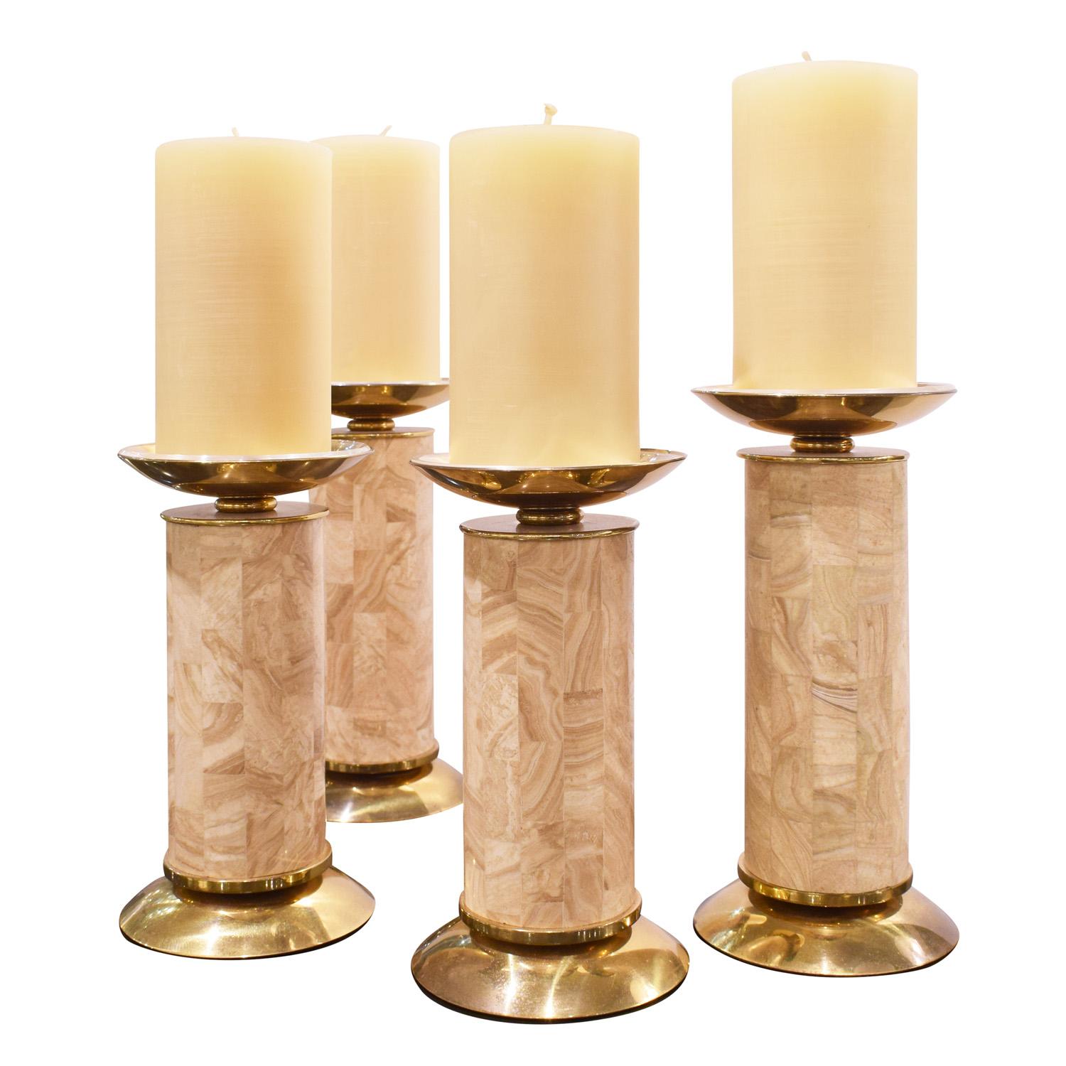 Exceptional set of 4 candle holders in tessellated stalactite travertine and polished brass by Karl Springer, American 1980's (retains original showroom labels on bottoms). This set is meticulously made in beautiful materials. These are one of the