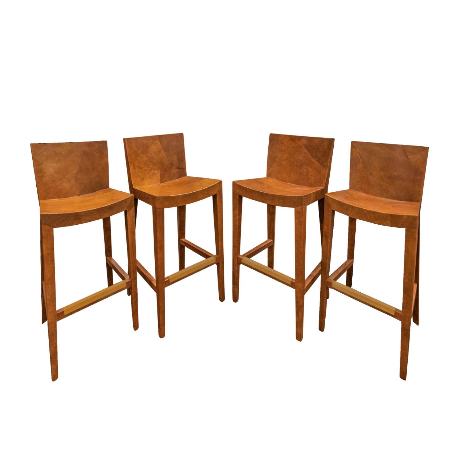 Set of 4 exceptional “J.M.F. Barstools” in brown leather with brushed brass foot rests by Karl Springer, American 1986 (signed and dated on bottom “Karl Springer 1986”). The craftsmanship on these bar stools is superb. The seats and backs gently