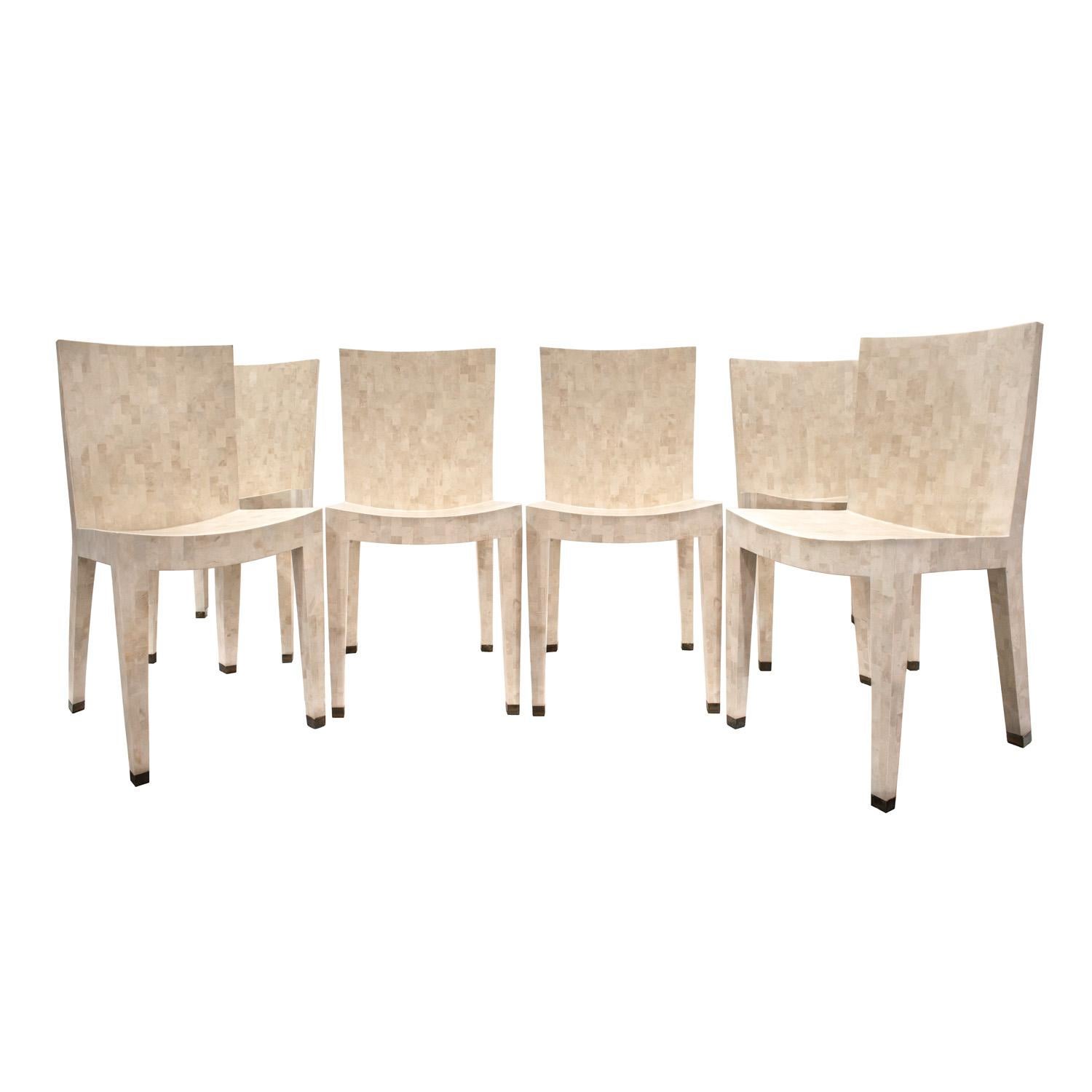 Set of 6 masterfully crafted J.M.F. Dining Chairs in tessellated fossilized coral with bronze sabots by Karl Springer, American 1980's. This chair was designed with a curved seat which can take a seat cushion if desired.  The artisanship of these