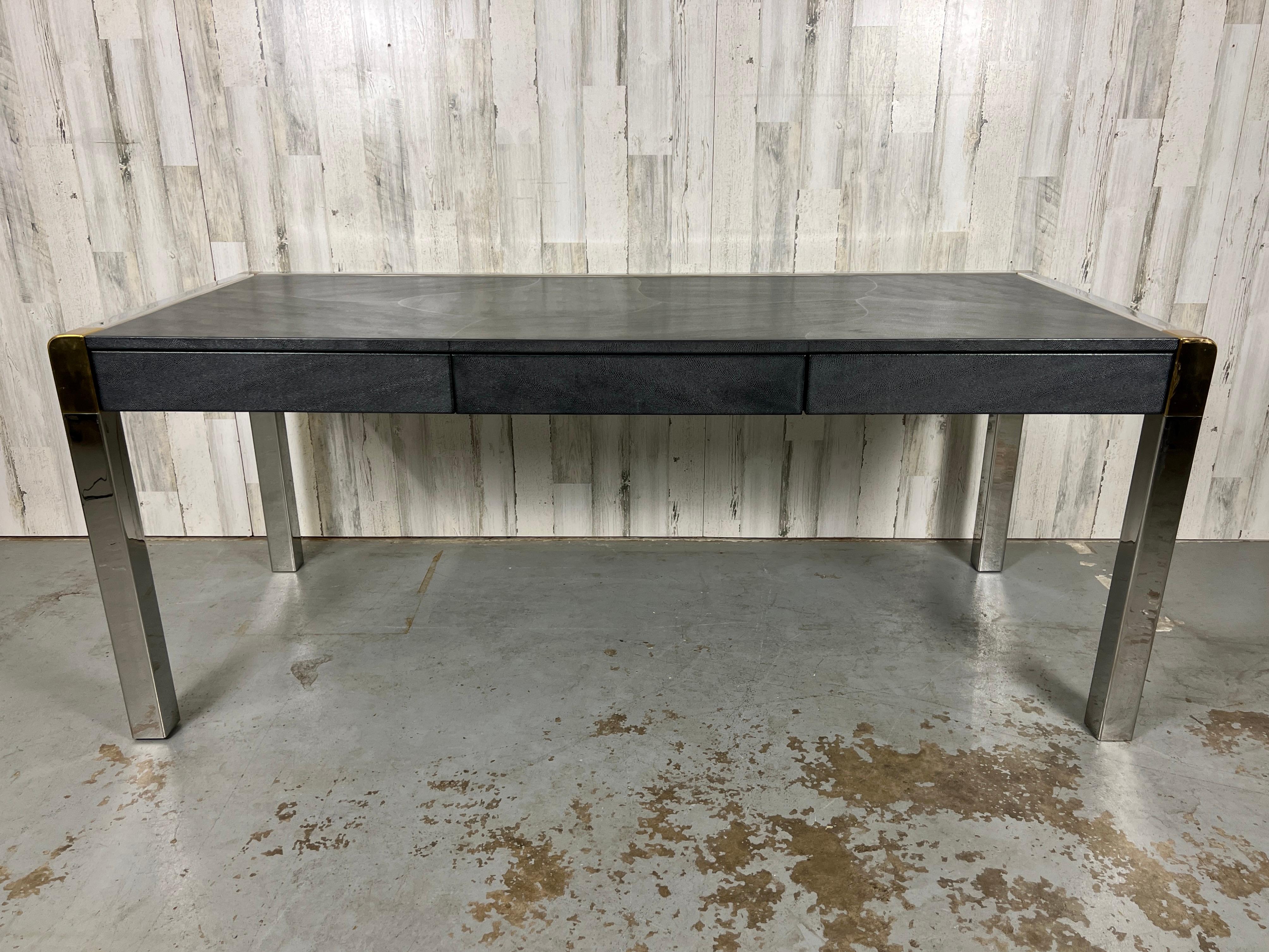 Extremely Rare Karl Springer Shagreen & chrome executive desk. Each corner has brass accents to compliment the chrome. Dark Shagreen top and drawers. A very classy and modern look! Original leather tag with signature and date on the bottom. Floor to