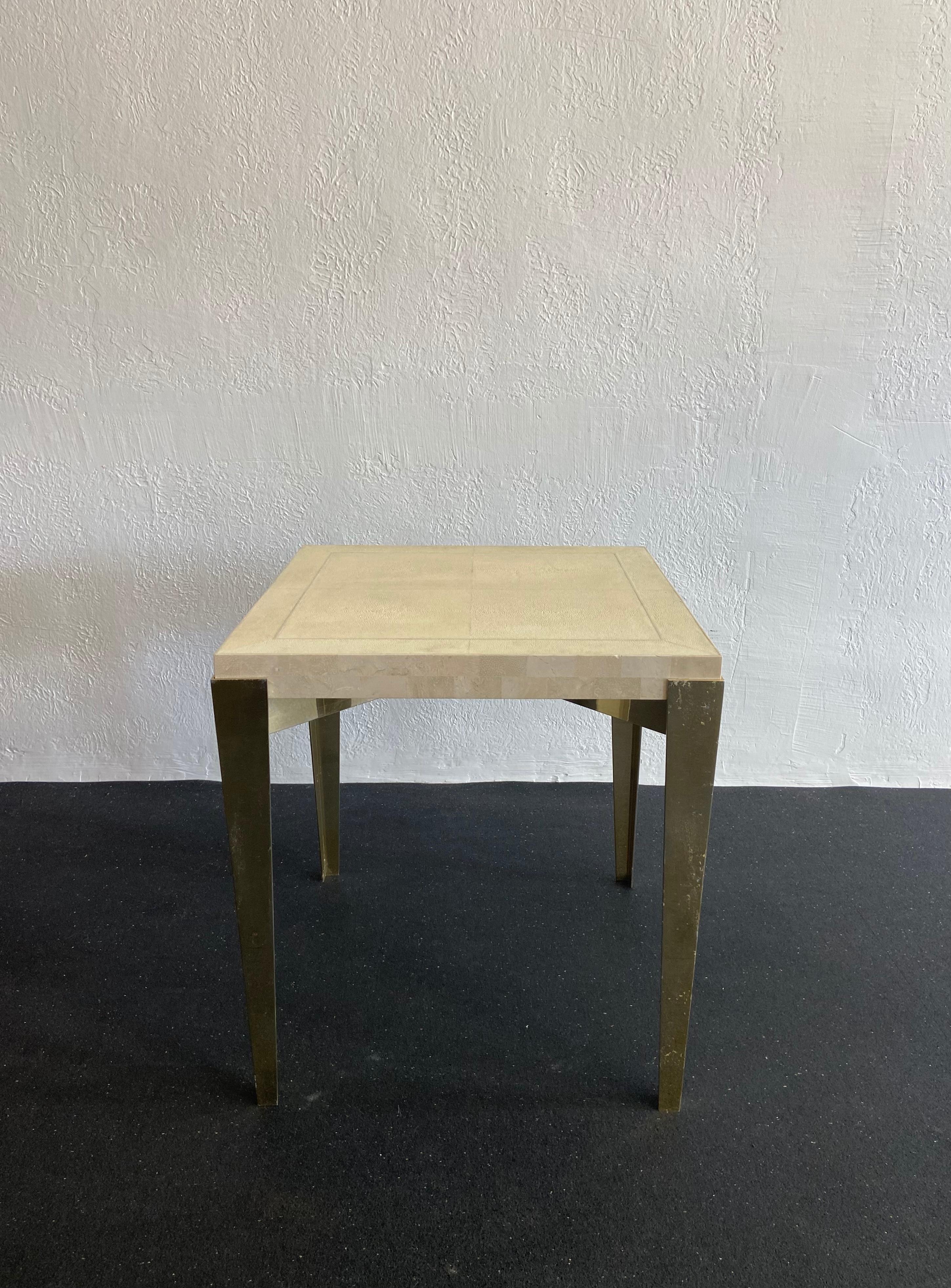 Rare occasional table by Karl Springer in shagreen, stone and anodized aluminum. Shagreen is in very good condition. Minor chips along stone edge. Wear to the anodized finish (please refer to photos). 

Would work well in a variety of interiors