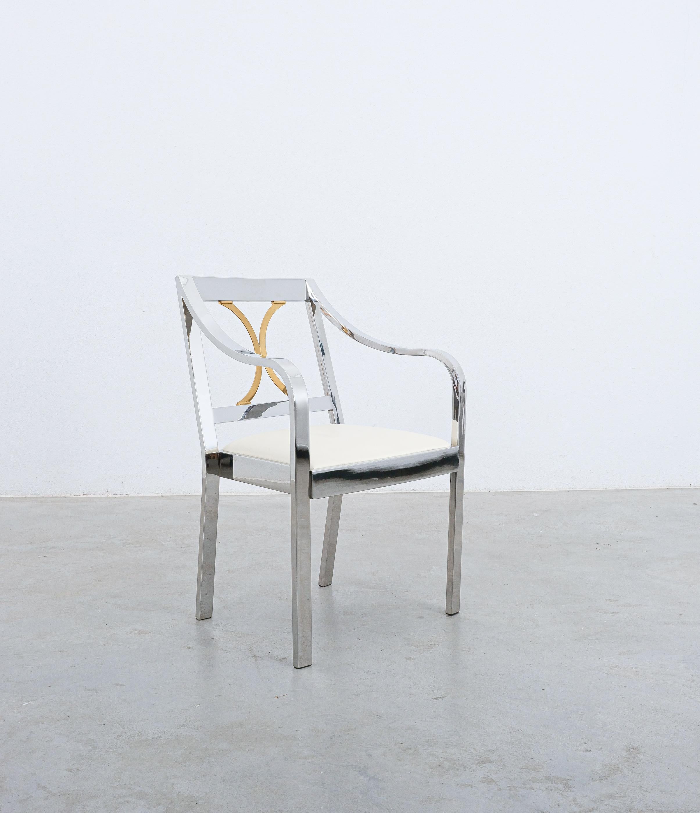 Regency style dining or side chair by Karl Springer, 1970

Great comfort chair, finely crafted Regency style dining or side chair by Karl Springer. Highly polished chrome plate over solid stainless steel. Brass seat back detail. Very soft white