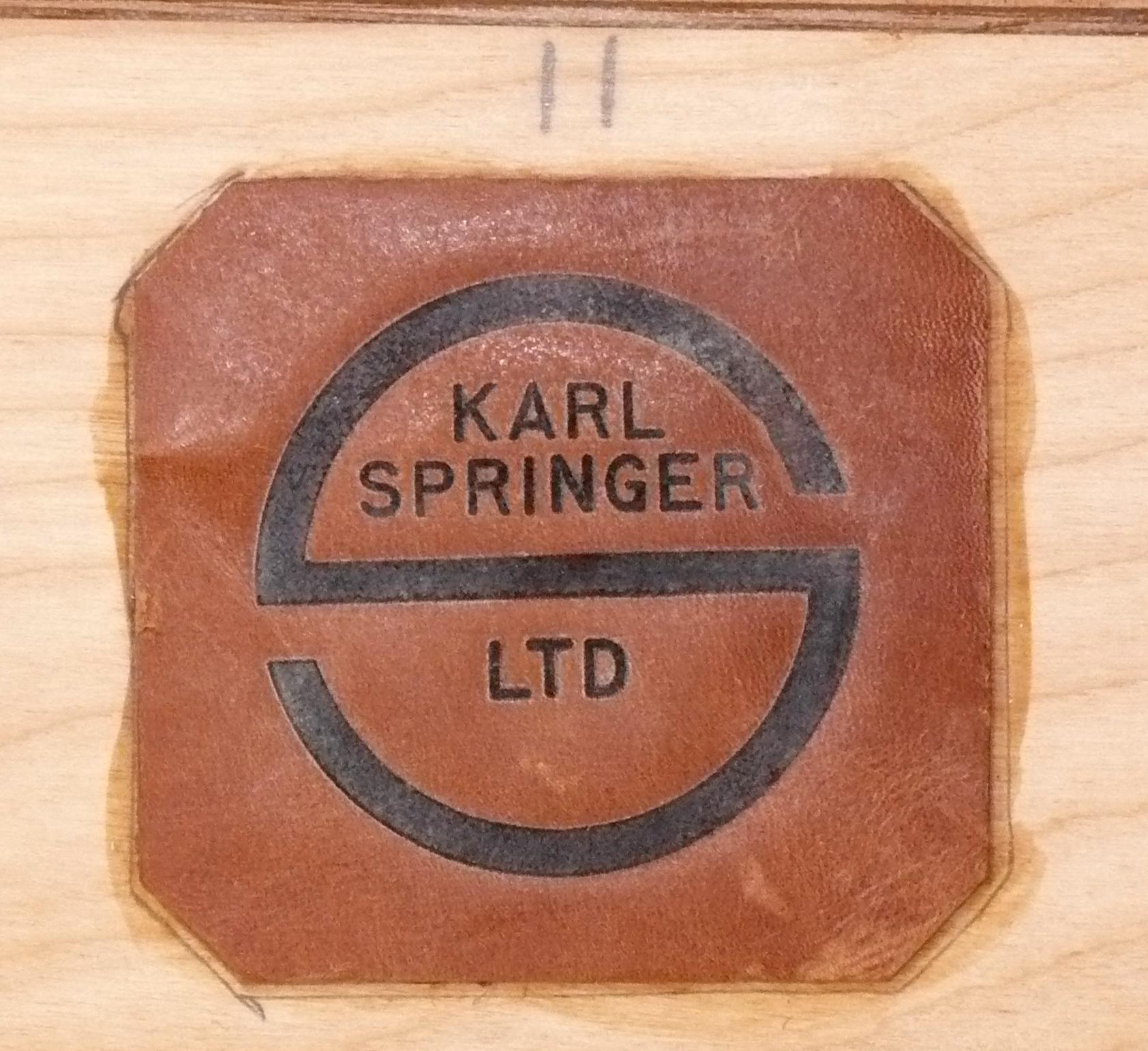 Karl Springer Signed Cognac Color Suede and Nickel Mirror, American, circa 1980s. Beautiful contrast of the cognac color suede and the matte finish chrome trim. Signed with branded Karl Springer tag on the back. It measures an impressive 42.5