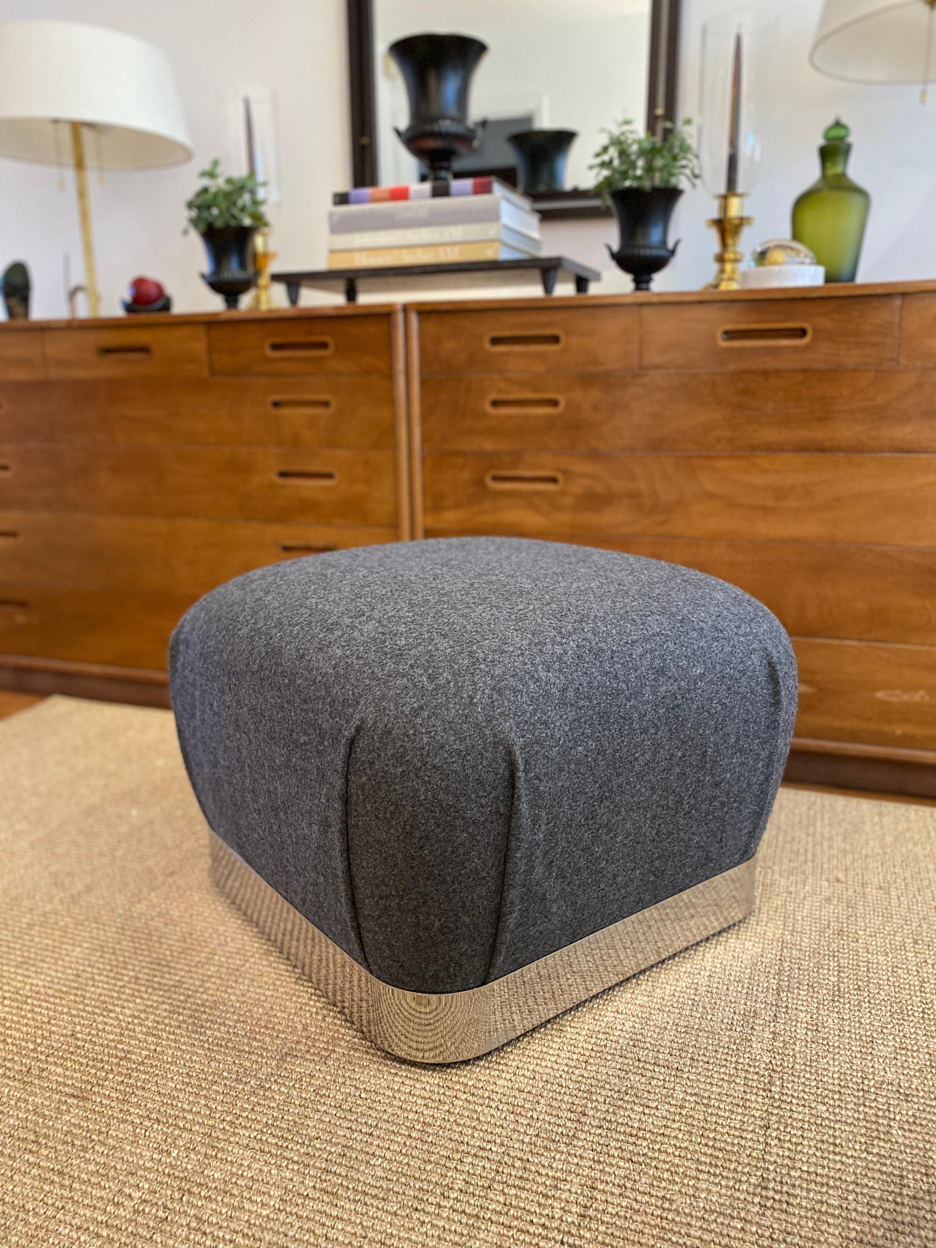 Vintage Karl Springer Soufflé ottoman or pouf recently reupholstered in a gray 100% wool felt. The Kvadrat fabric is Divine Melange 3, 170 gray, by Finn Sködt. The ottoman is approximately 18 inches tall with a width and depth of 22 inches. The