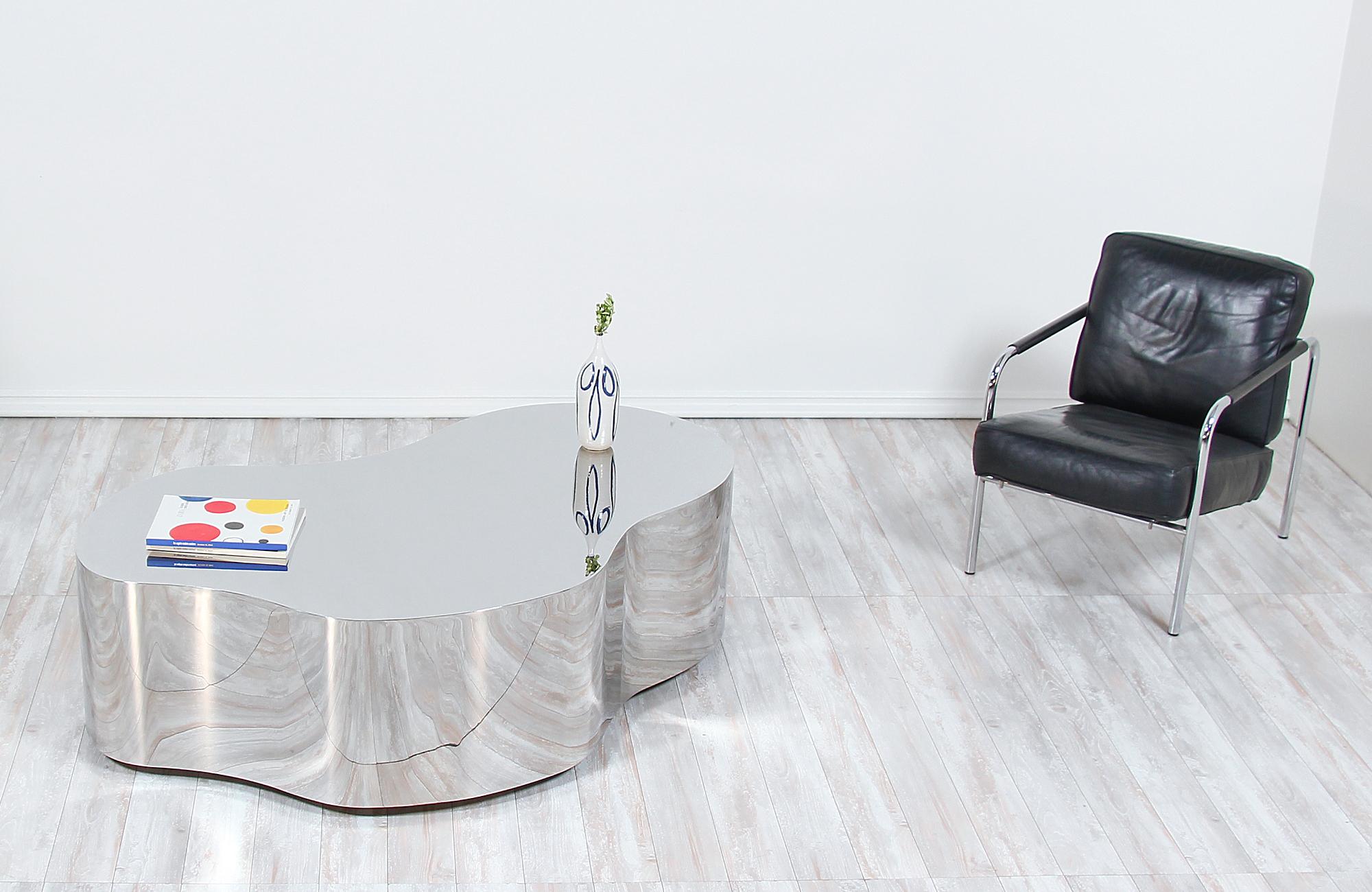 Iconic freeform low table designed and manufactured by Karl Springer in the United States, circa 1970. Designed by one of the most influential furniture designers of the later 20th century, this sleek and elegant table design has been meticulously