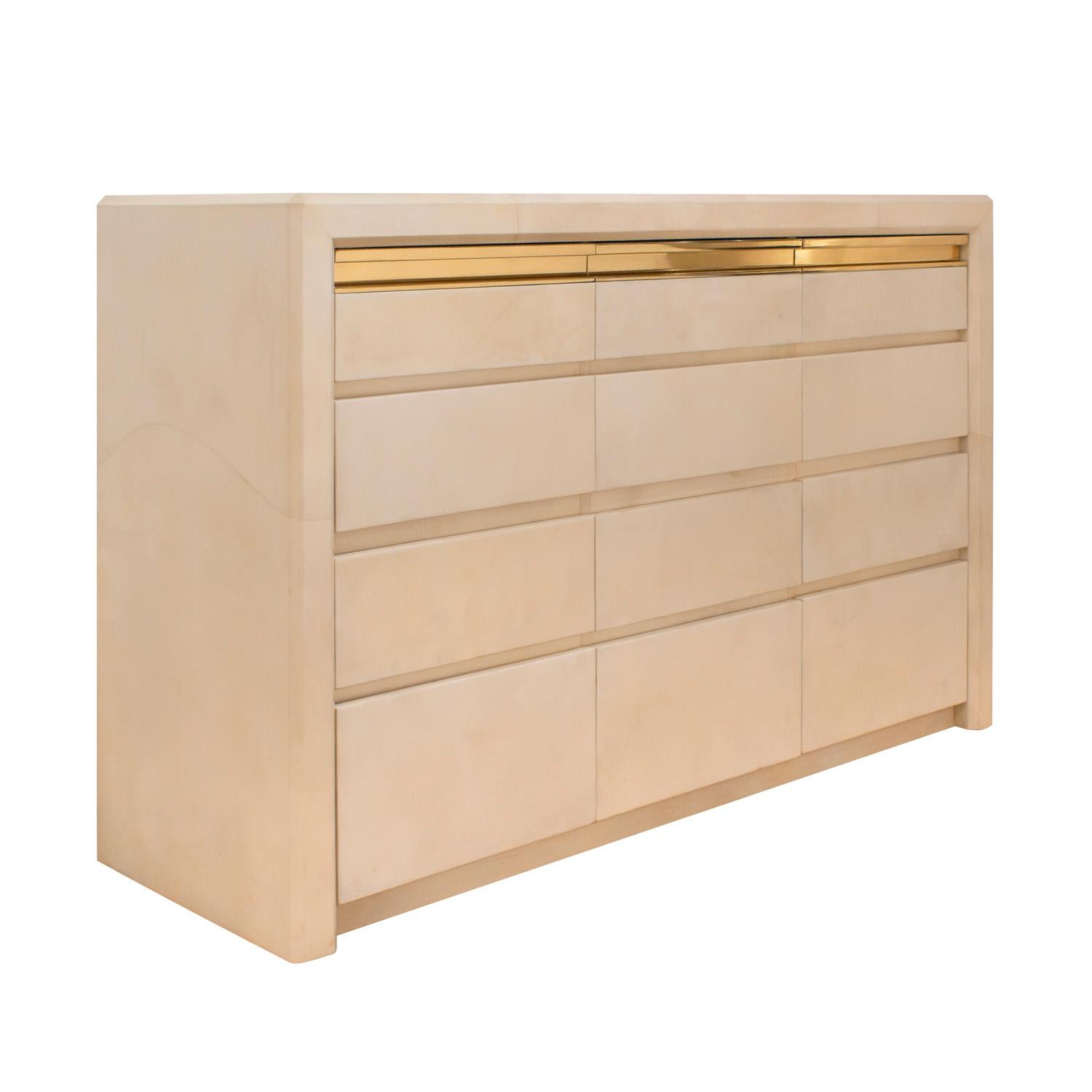 Rare and exceptional chest of drawers in lacquered goatskin, top drawers with artisan brass pulls, by Karl Springer, American 1980's.  This is one of the only known Karl Springer chest of drawers in lacquered goatskin made in this model.  The
