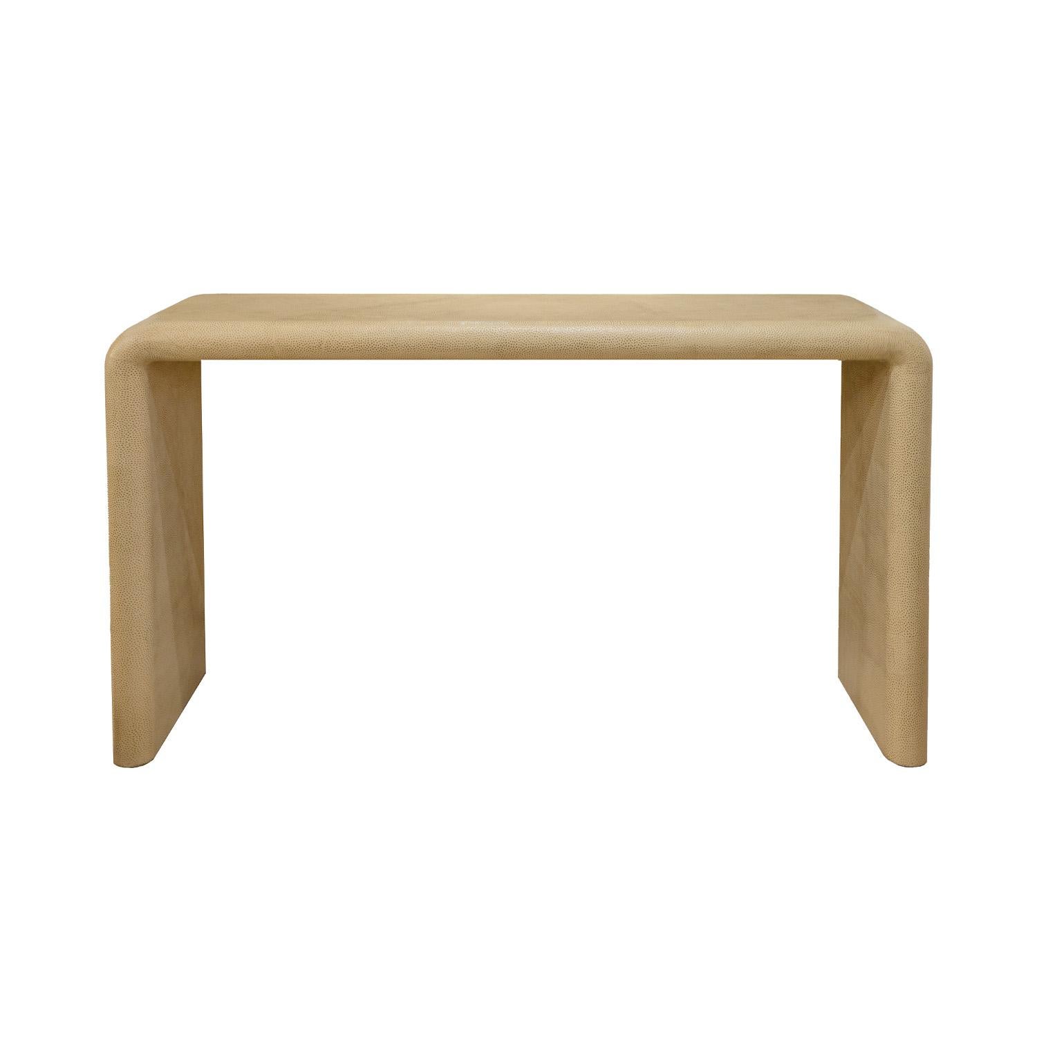 “Curved-End Console Table” in ivory emu skin with gold overlay by Karl Springer, American 1993 (signed “Karl Springer 1993” on the underside of the console). The gold overlay beautifully accents the color of the skins.  The materials and