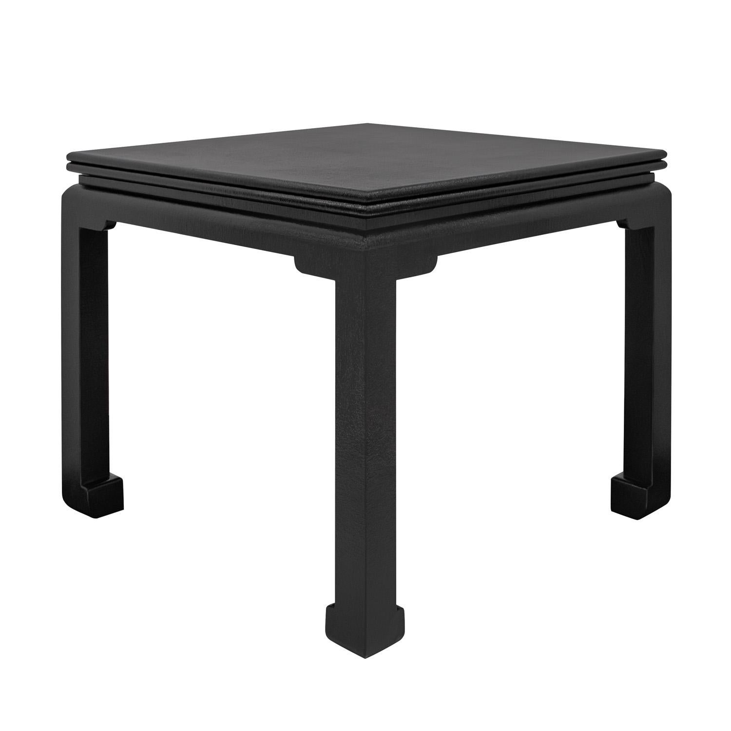 Beautifully crafted Ming Style Flip Top Game/Dining Table in black lacquered linen by Karl Springer, American 1980's. The top opens on brass hinges which allow it to extend out to double the width. As with all Karl Springer pieces, the attention to