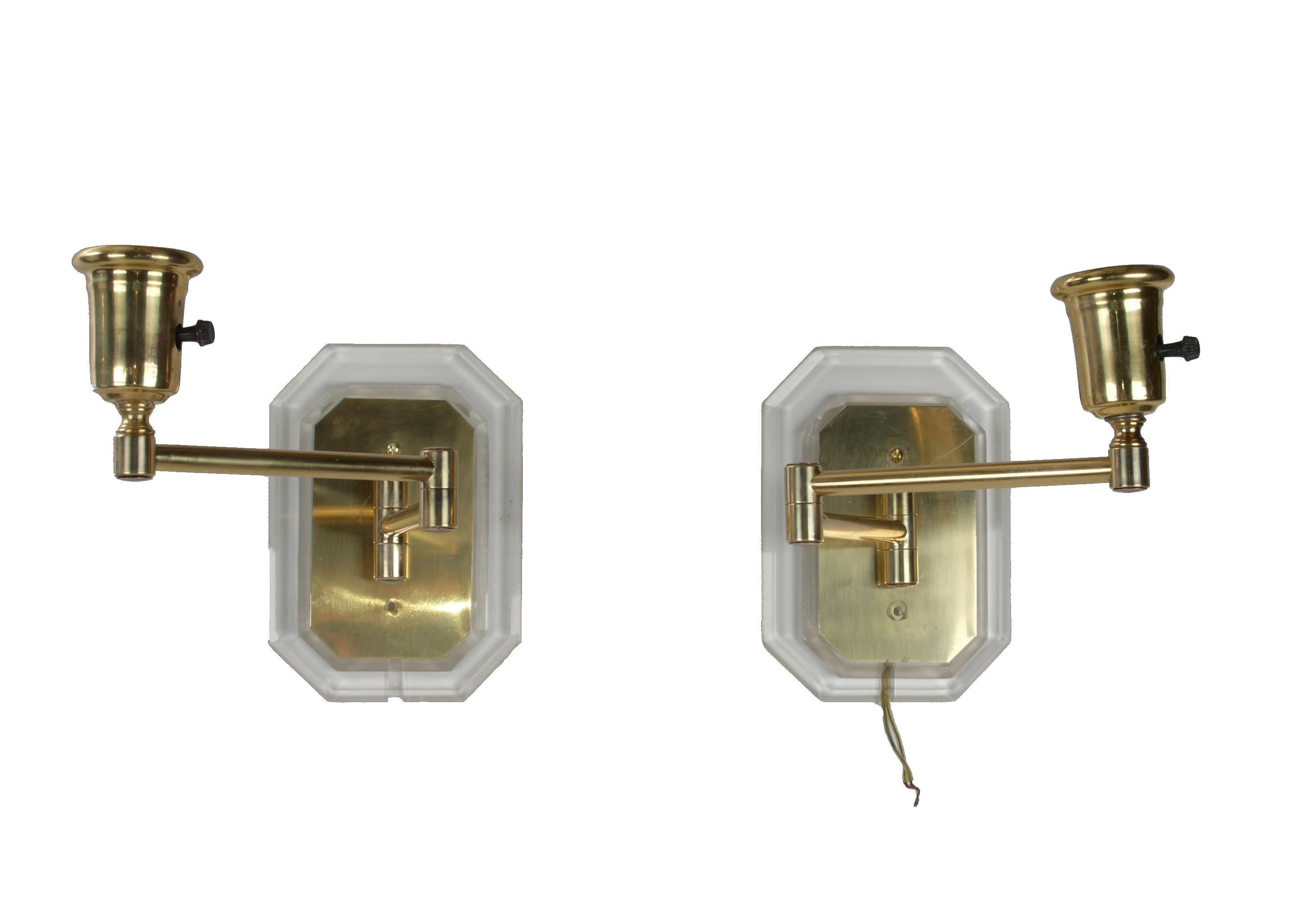 A pair of Mid-Century Modern Lucite and brass swing wall sconces in the style of Karl Springer. Wired for the U.S. and each uses a max. 60 wattage light bulb.
No shades.
Simply gorgeous.