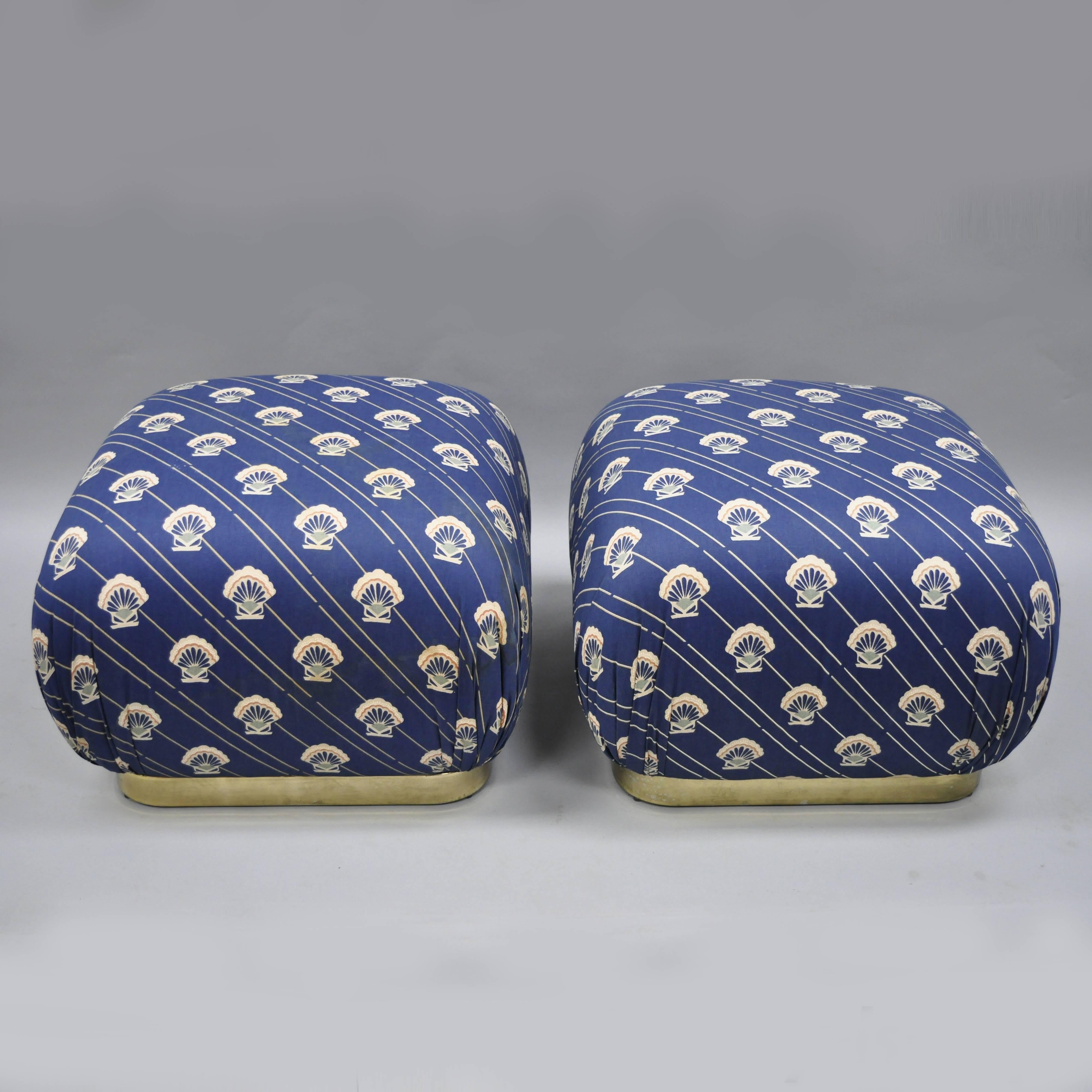 Pair of Weiman brass base upholstered pouf ottomans in the Karl Springer style. Item features brass-plated metal base, upholstered seat, original label, clean modernist lines, great style and form, mid-late 20th century. Measurements: 17